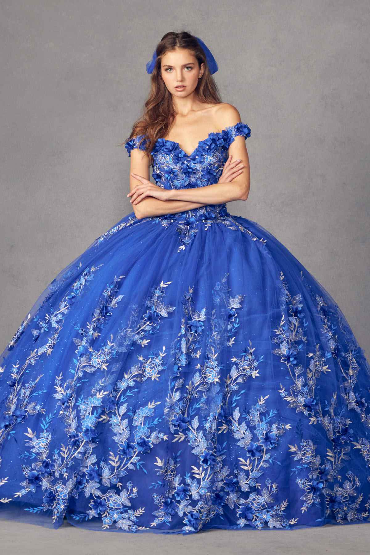 Blue off-shoulder ball gown with dense floral embroidery and voluminous tulle skirt