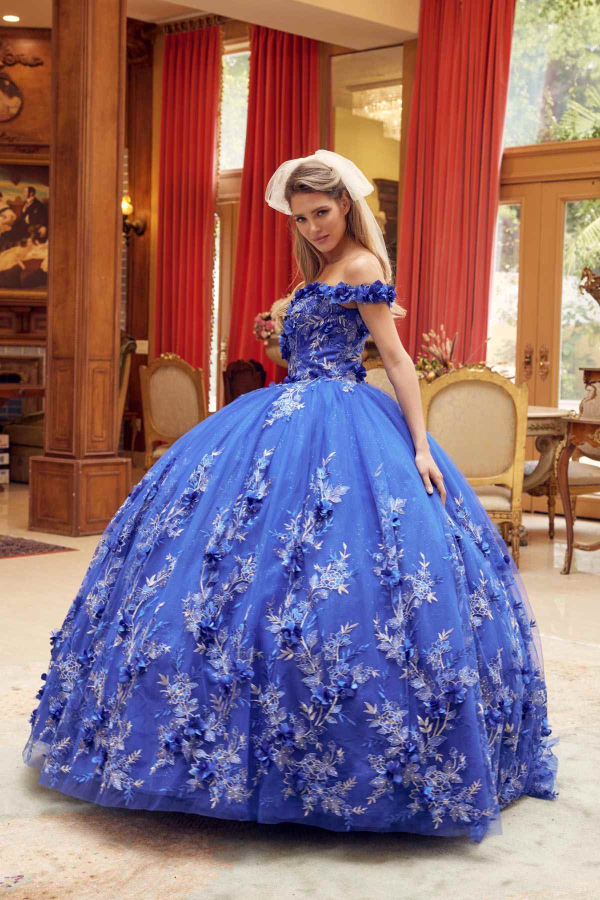 Blue off-shoulder ball gown with embroidered 3D floral detail and voluminous skirt