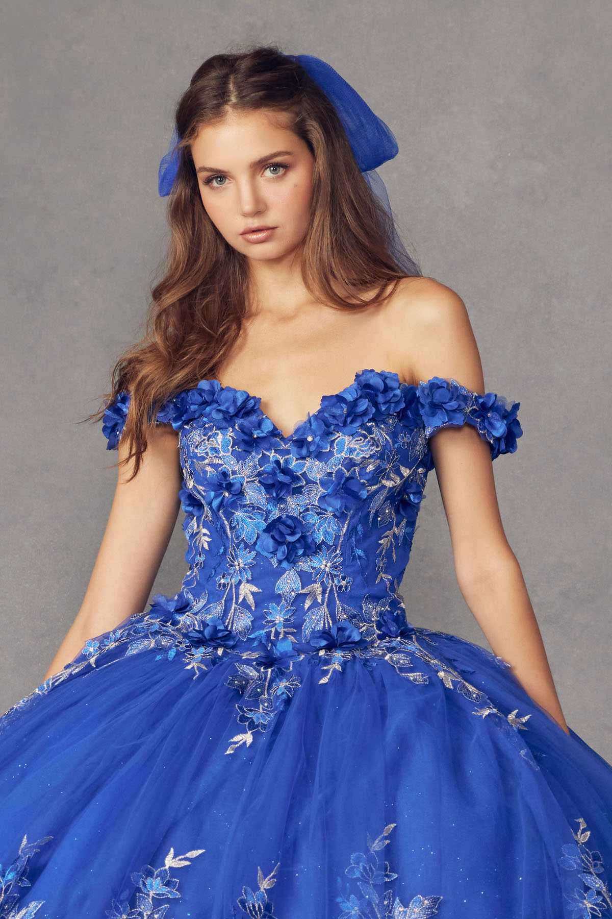 Blue off-shoulder ball gown with 3D floral bodice and full skirt of embroidered details