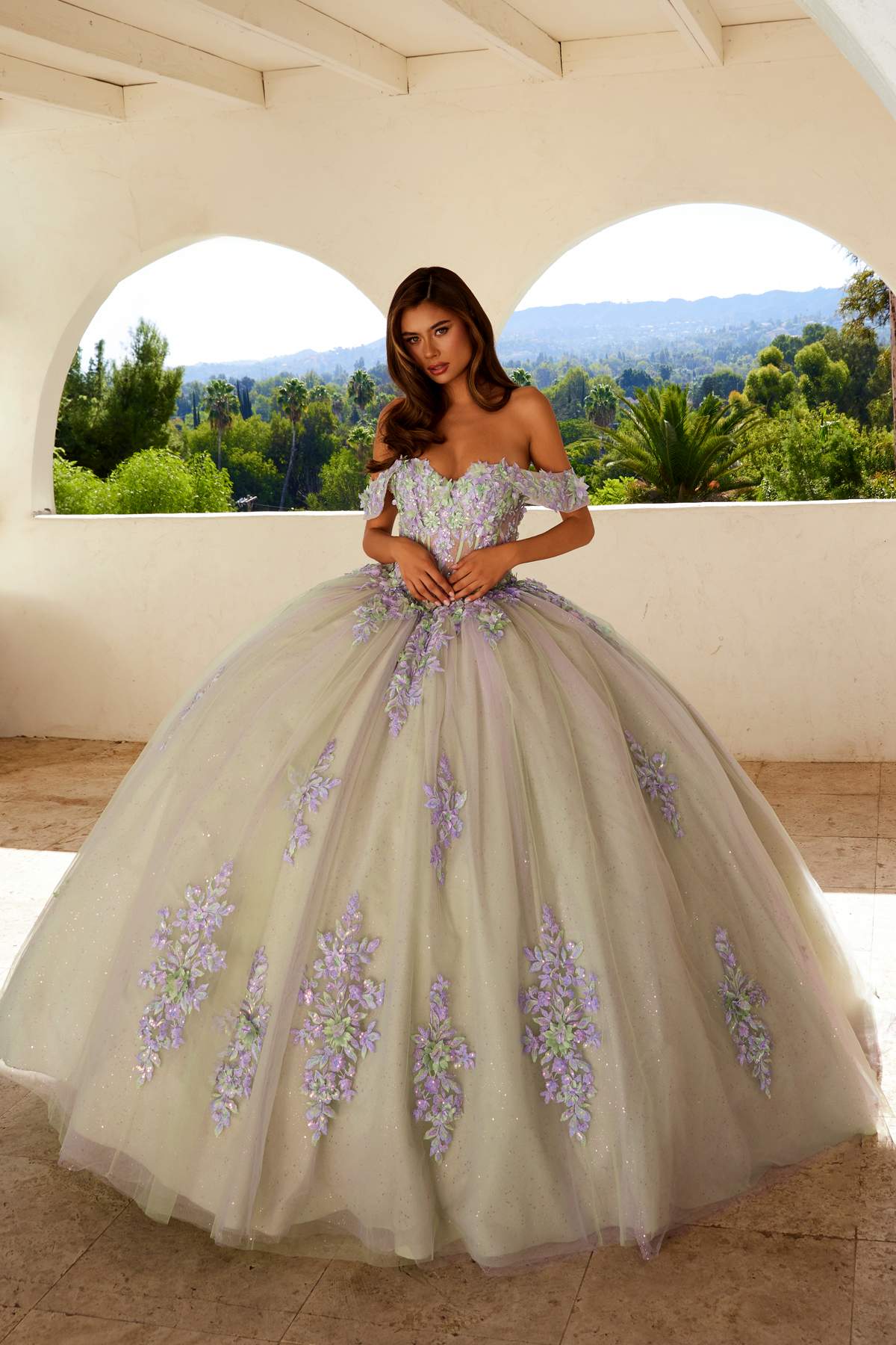 Off-shoulder ball gown with lilac floral appliques and corset bodice, full skirt