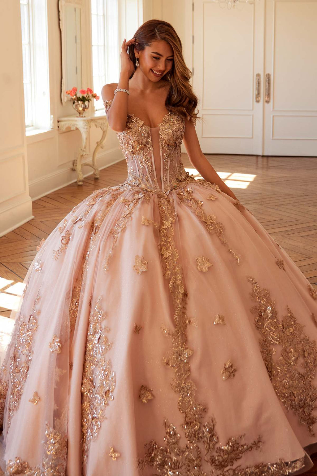 Off-shoulder blush pink corset bodice ball gown with rose-gold embroidered skirt