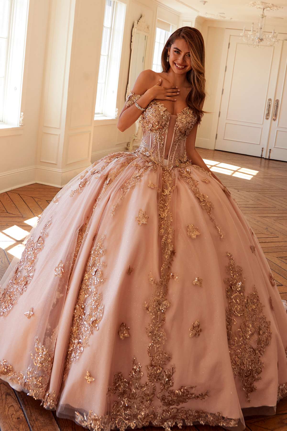 Off-shoulder blush pink ball gown with rose-gold embroidery, wide skirt flare