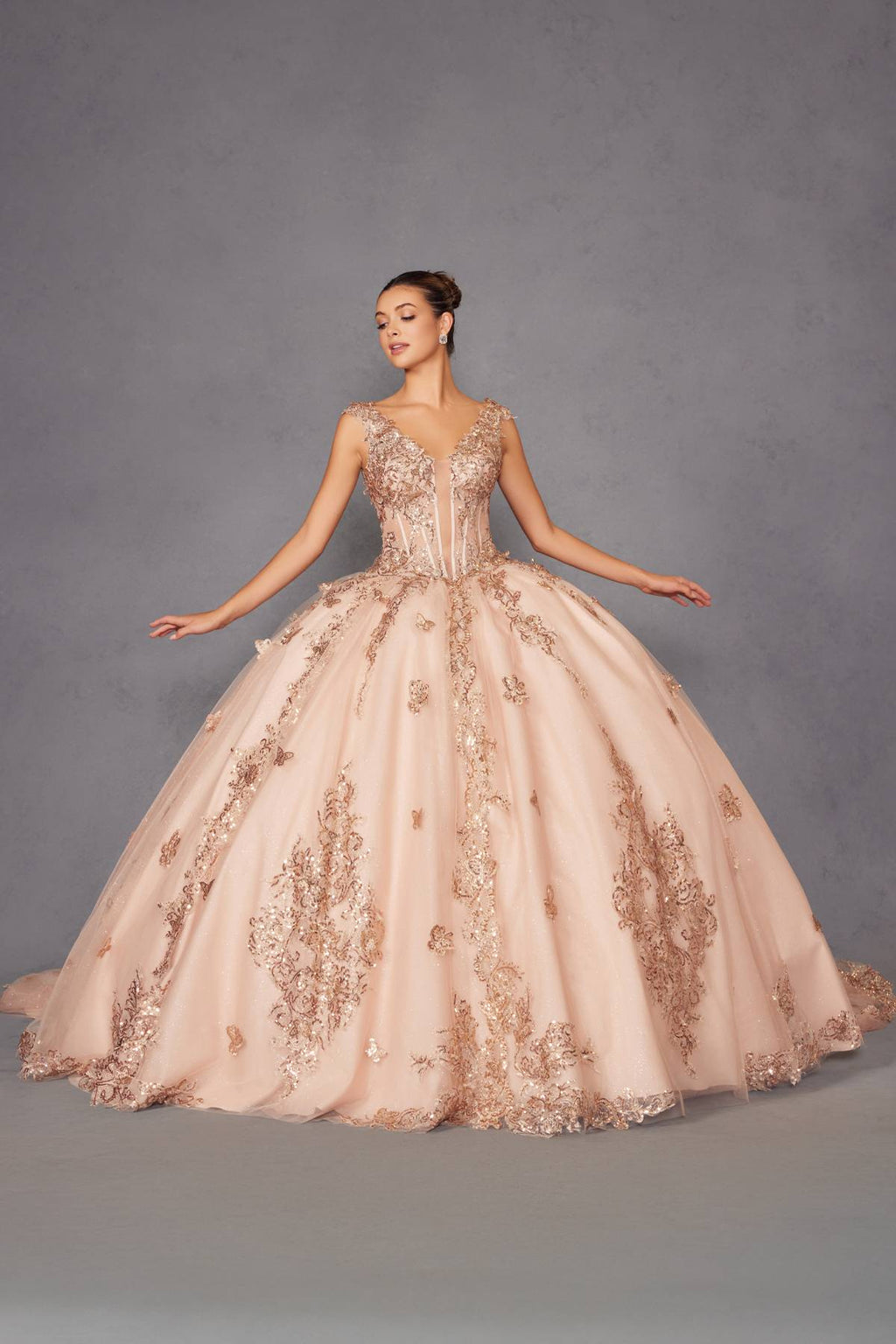 Blush pink ball gown with off-shoulder rose-gold embroidery, arms out full skirt