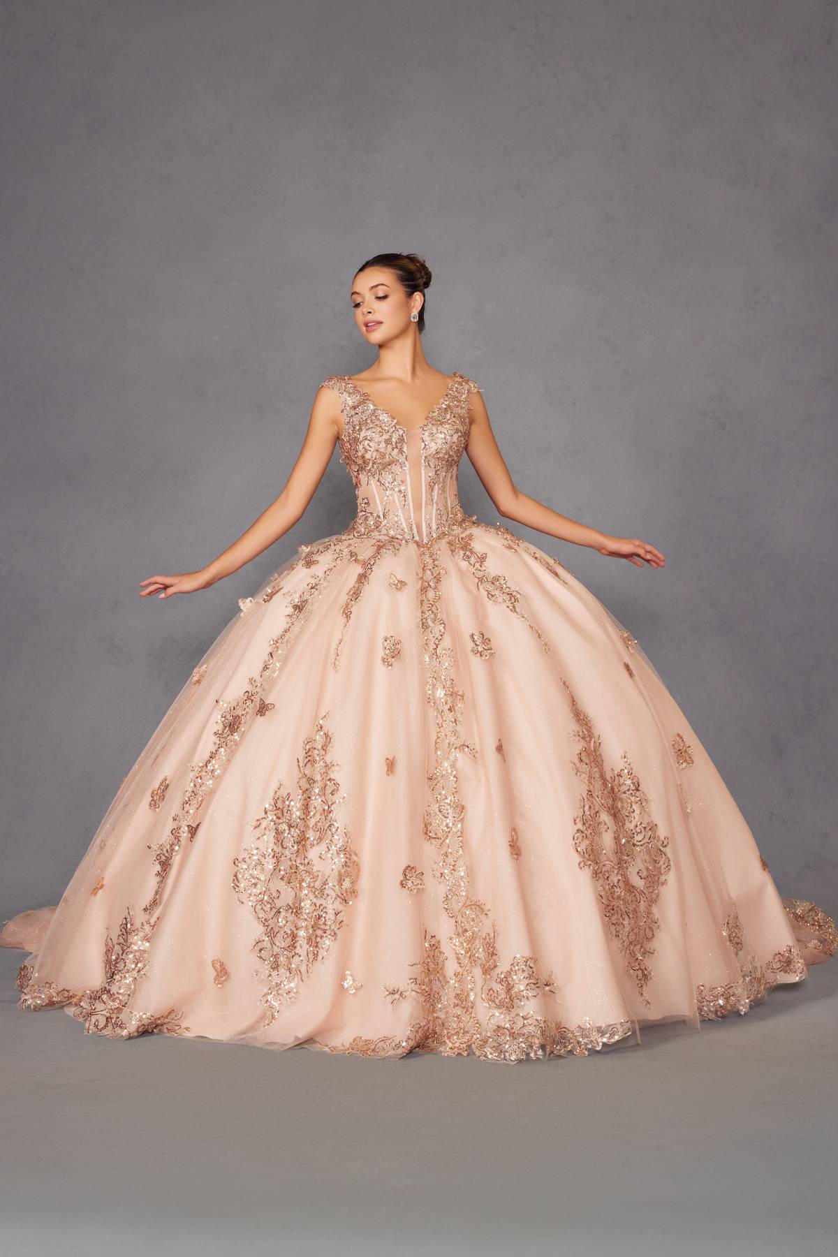 Blush pink ball gown with off-shoulder rose-gold embroidery, arms out full skirt