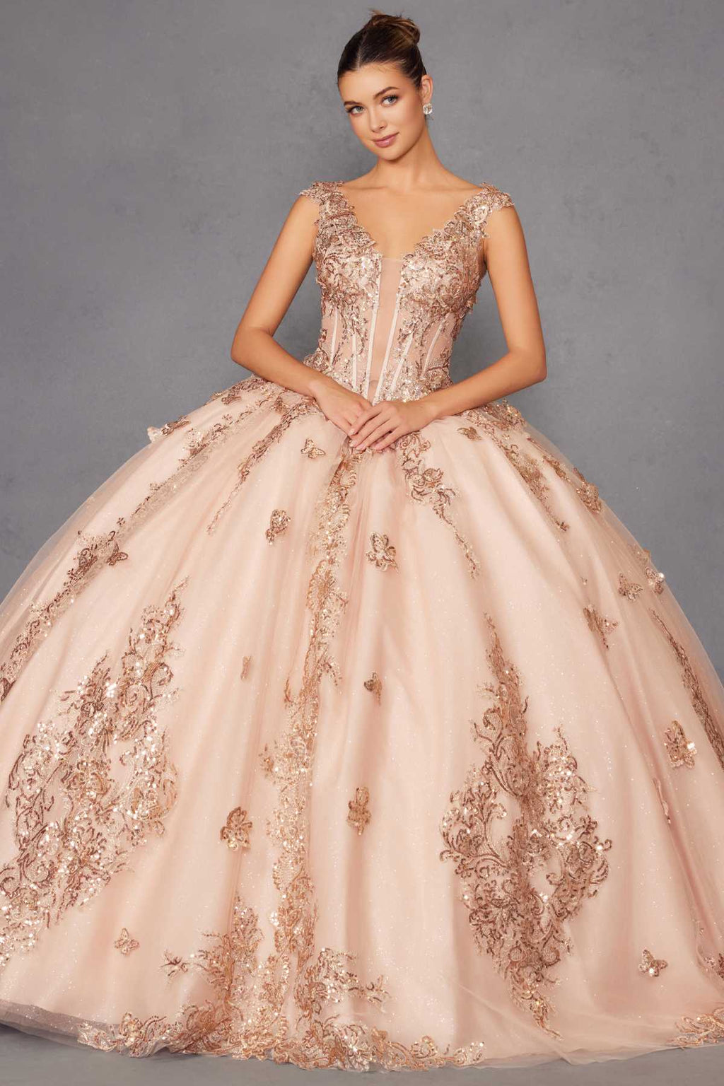 Blush pink off-shoulder ball gown with rose-gold embroidered bodice and full skirt