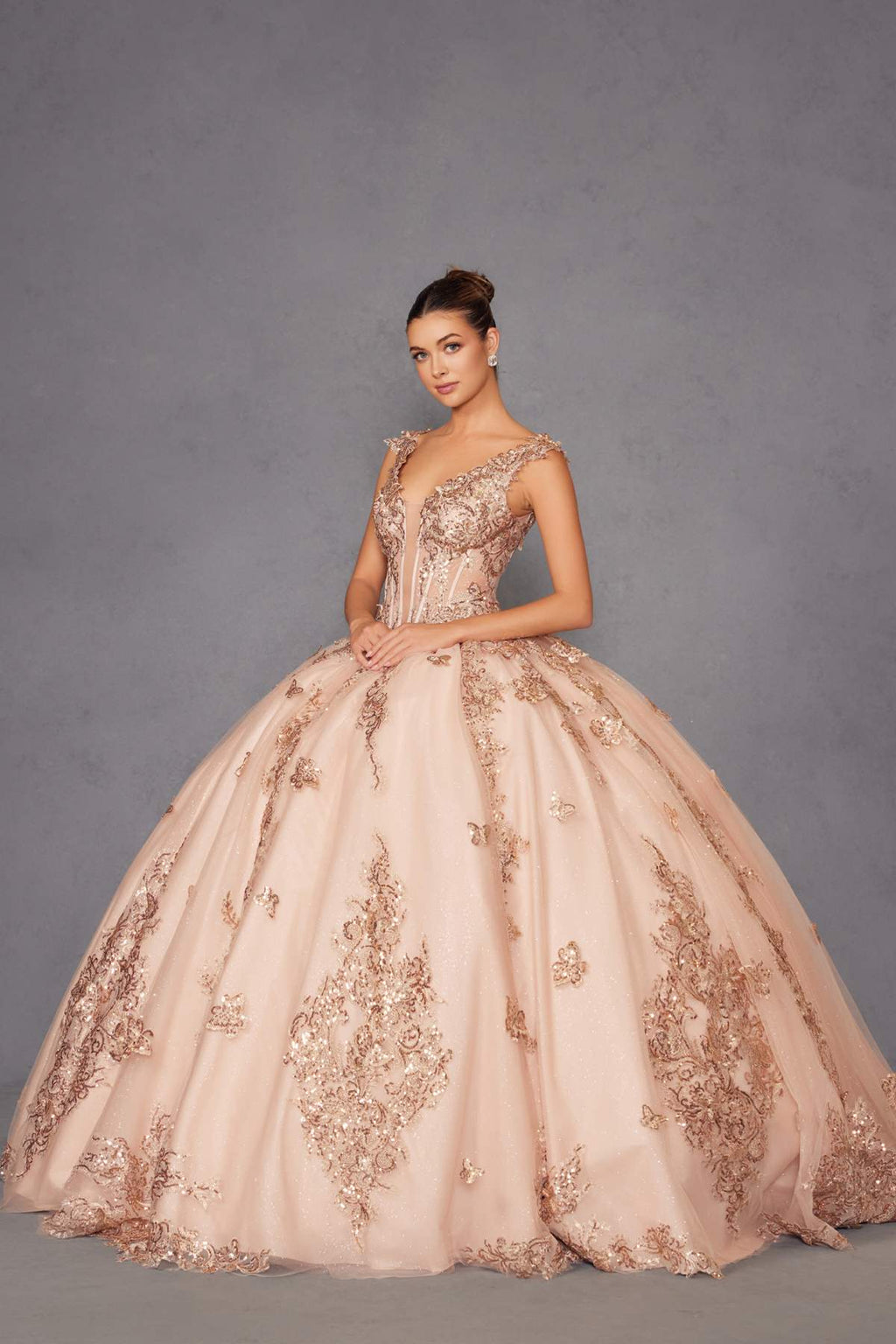 Rose gold off-shoulder ball gown with sparkling lace bodice and full embroidered skirt