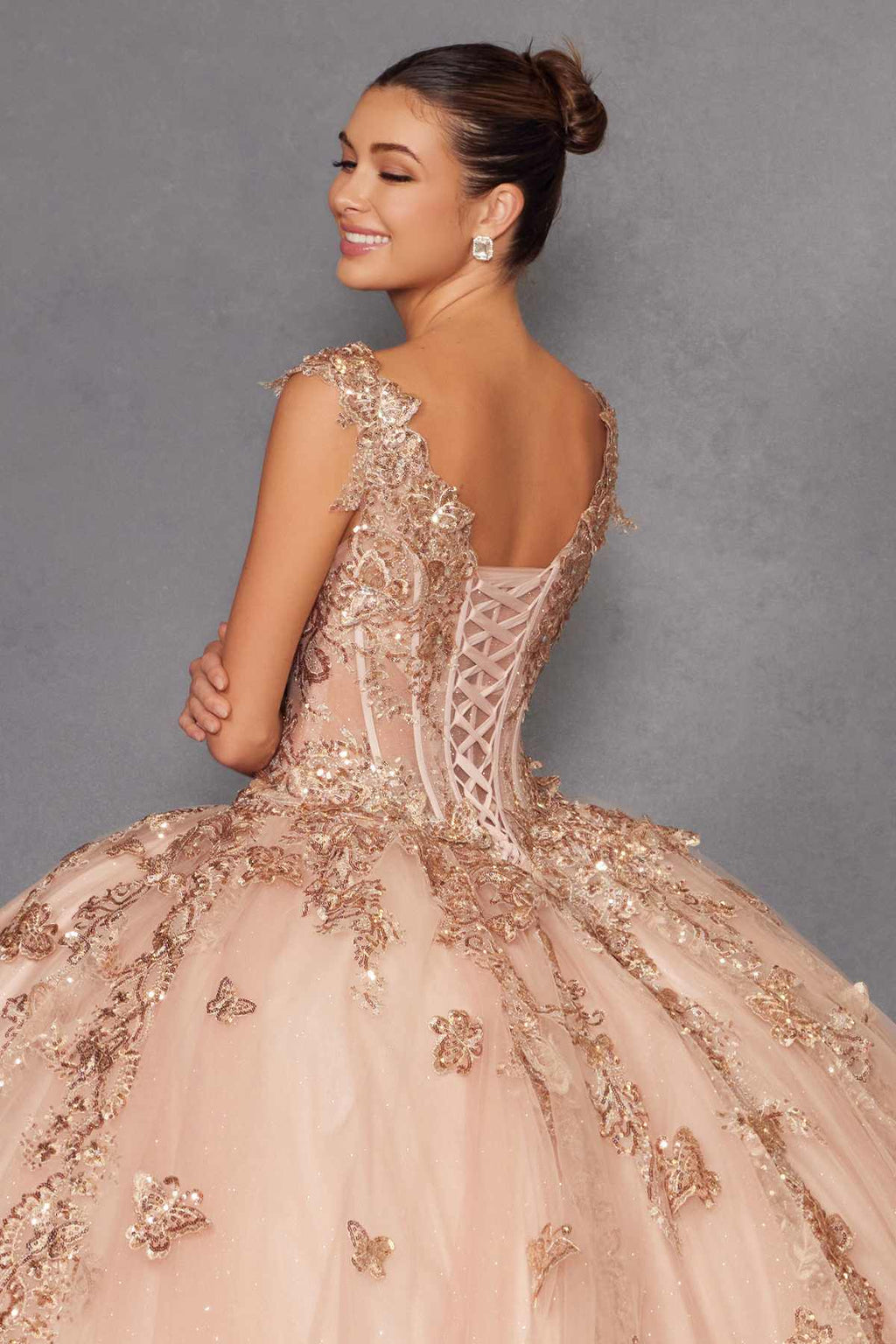 Rose gold off-shoulder ball gown with corset-style lace back and embroidered tulle skirt