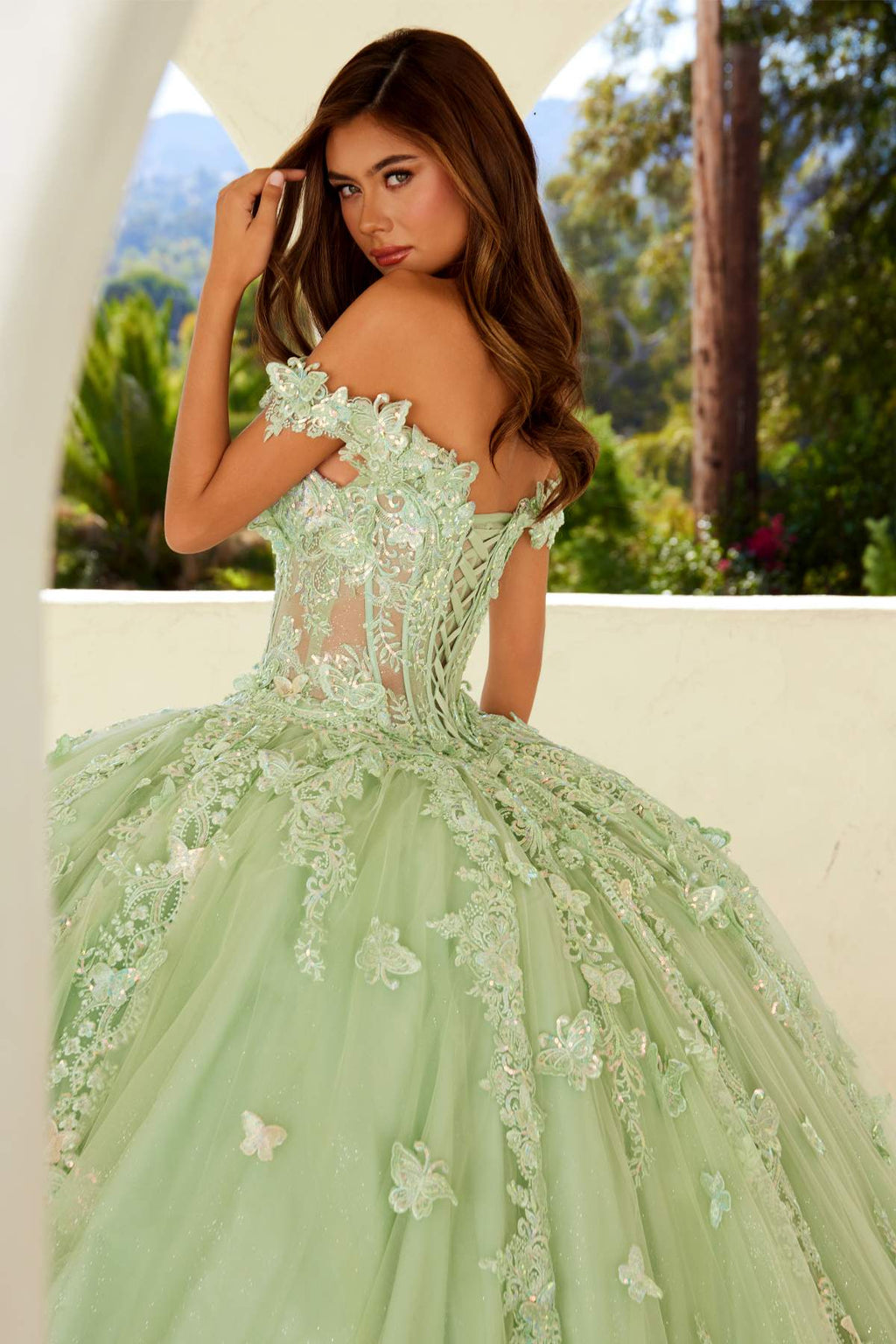 Sage green off-shoulder ball gown with fitted lace bodice and floral applique tulle skirt