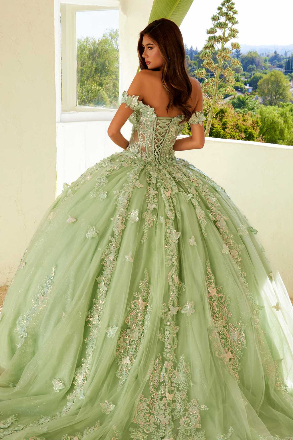 Sage green off-shoulder ball gown with jeweled corset bodice and full embroidered skirt