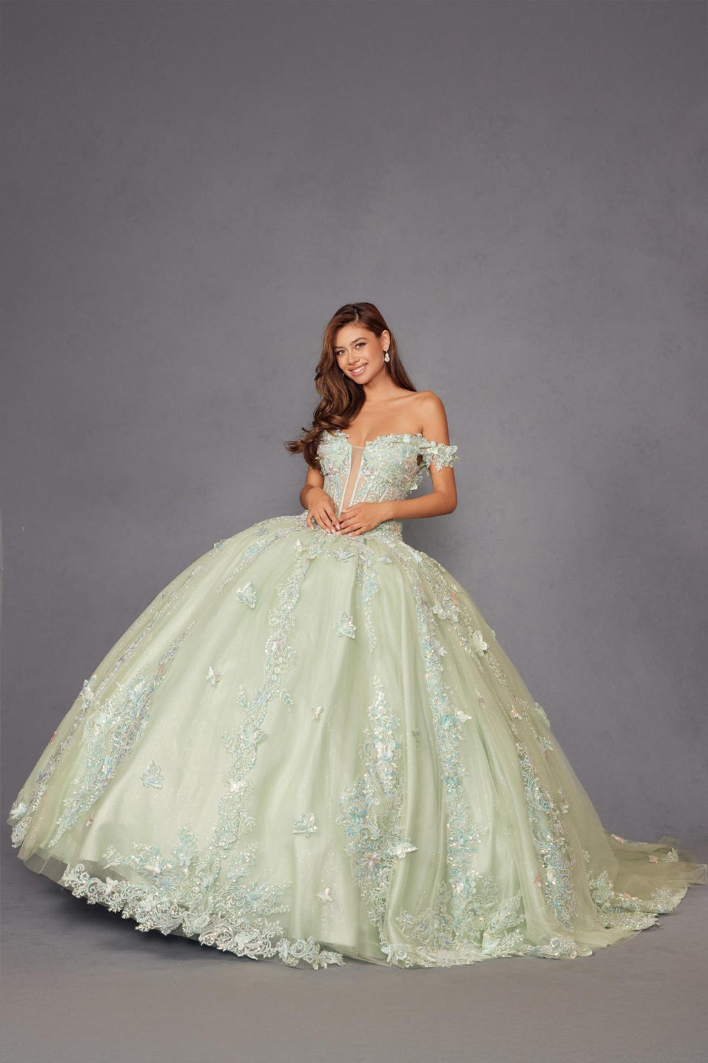 Sage green off-shoulder corset ball gown with embroidered tulle skirt, side view