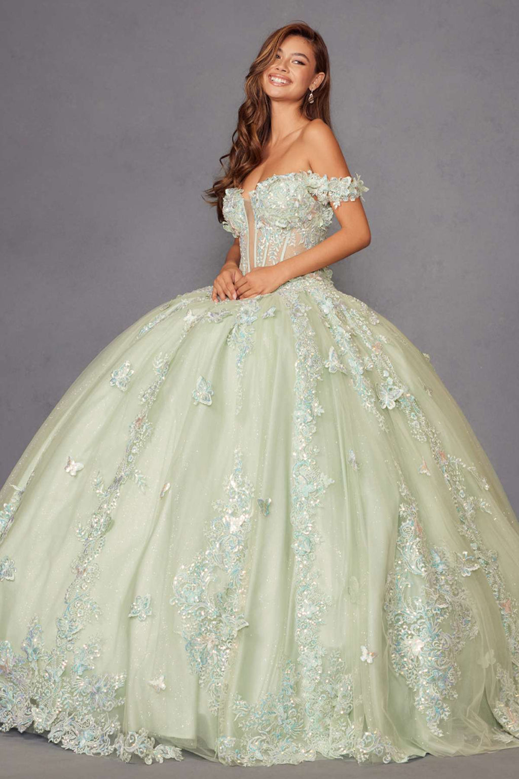 Sage green off-shoulder quinceanera ball gown with corset bodice and voluminous tulle skirt