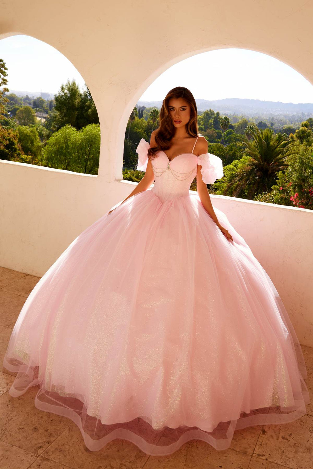 Baby pink off-shoulder ball gown with tulle skirt and puff sleeves