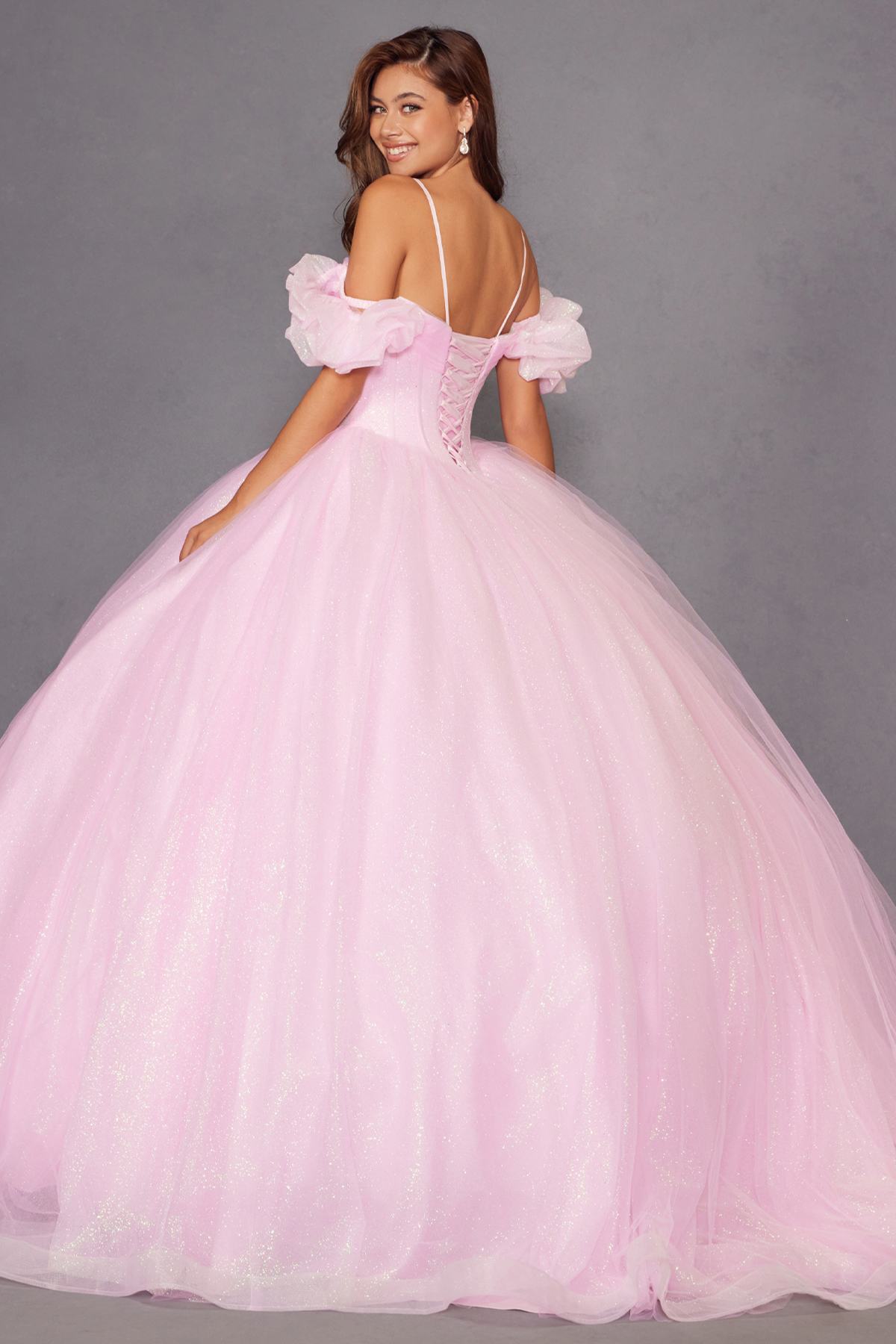 Light pink cold-shoulder ball gown with ruffled sleeves and corset-style bodice, full tulle skirt