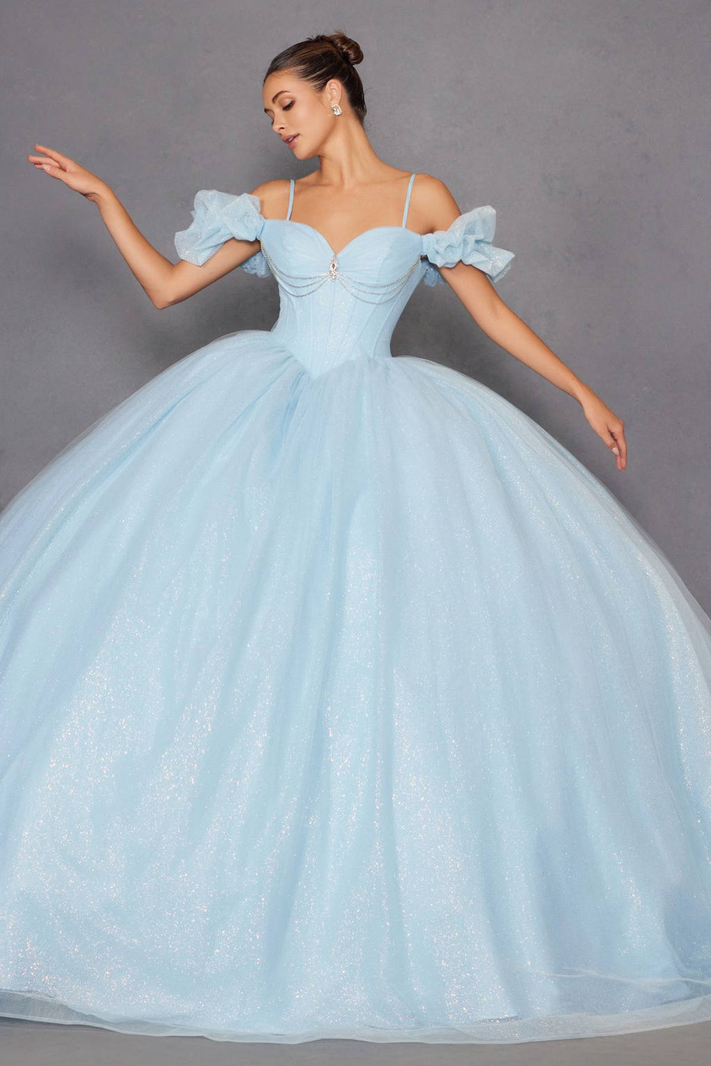 Bahama blue cold-shoulder ball gown with sweetheart neckline, ruffled sleeves, and voluminous tulle skirt