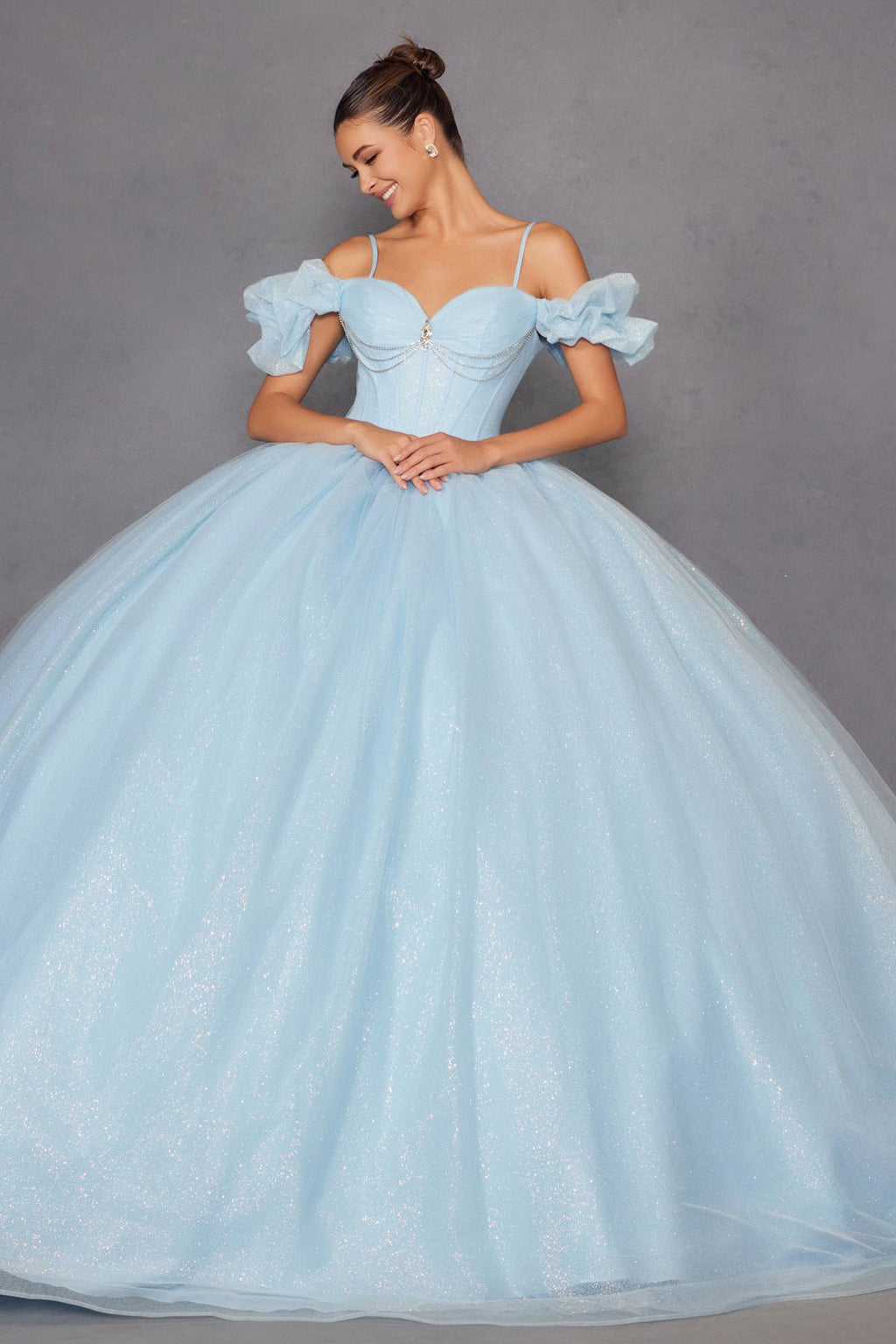 Light blue cold-shoulder ball gown with full glitter tulle skirt and lace-up bodice detail