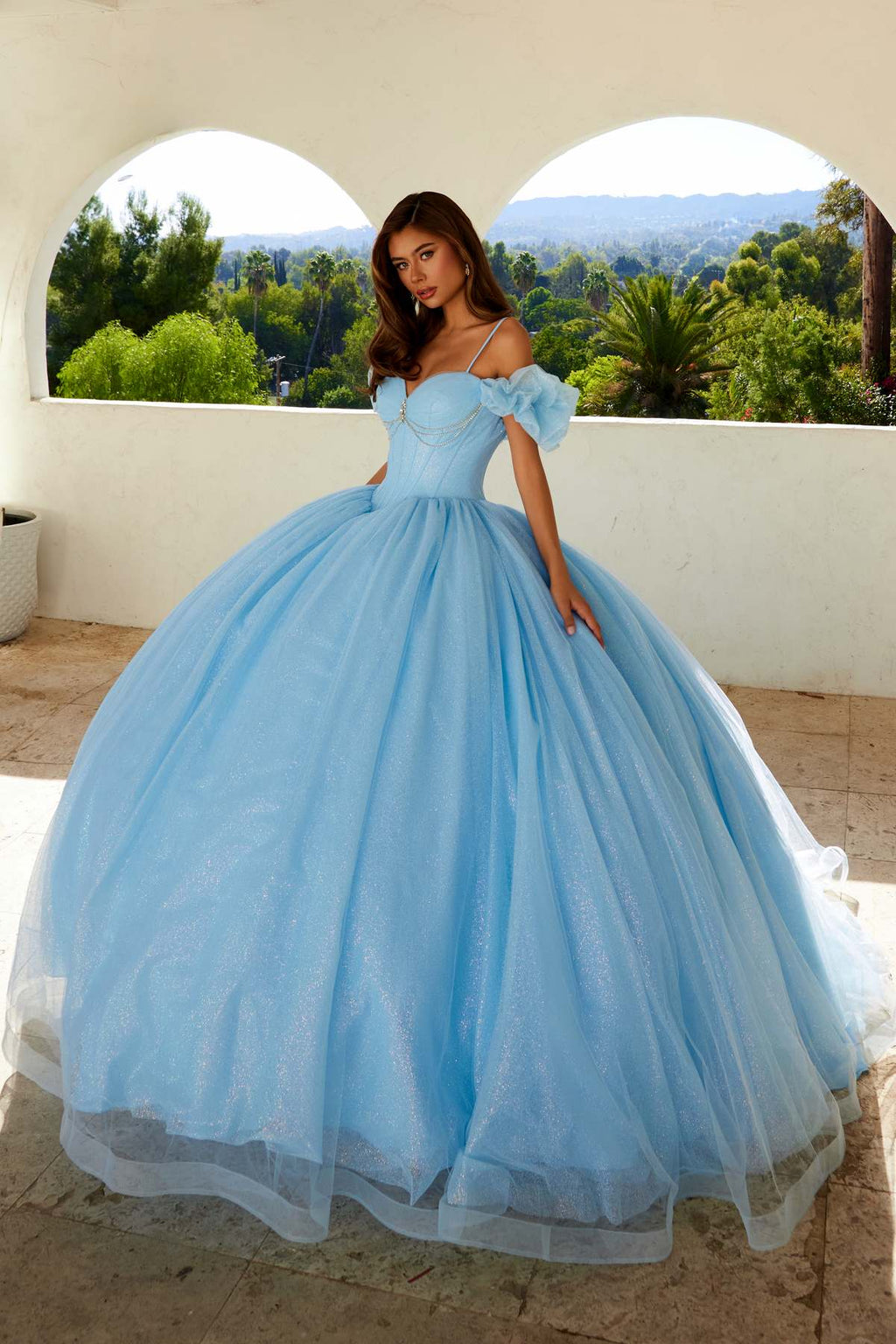 Bahama blue cold-shoulder ball gown with sweetheart neckline, puff sleeves, and full tulle skirt