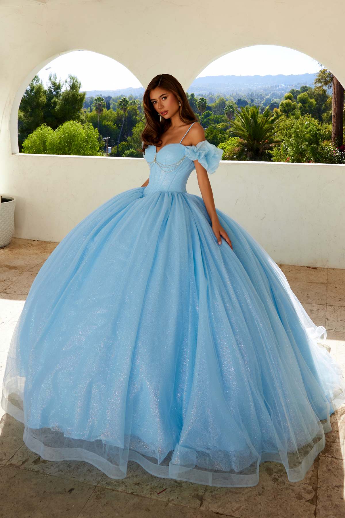 Bahama blue cold-shoulder ball gown with sweetheart neckline, puff sleeves, and full tulle skirt