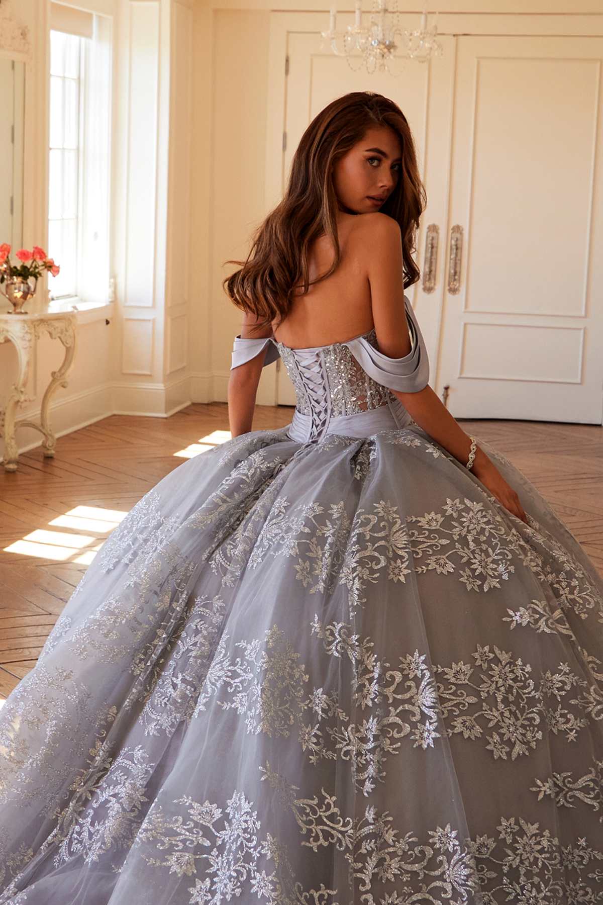 Silver A-line ball gown bodice detail with corset waist and glitter floral embroidery