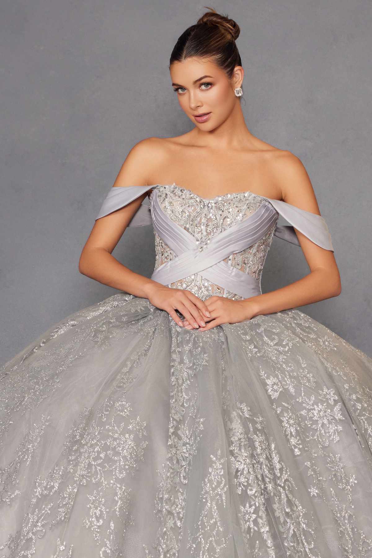 Silver A-line ball gown with off-shoulder sleeves and sparkling embroidered bodice