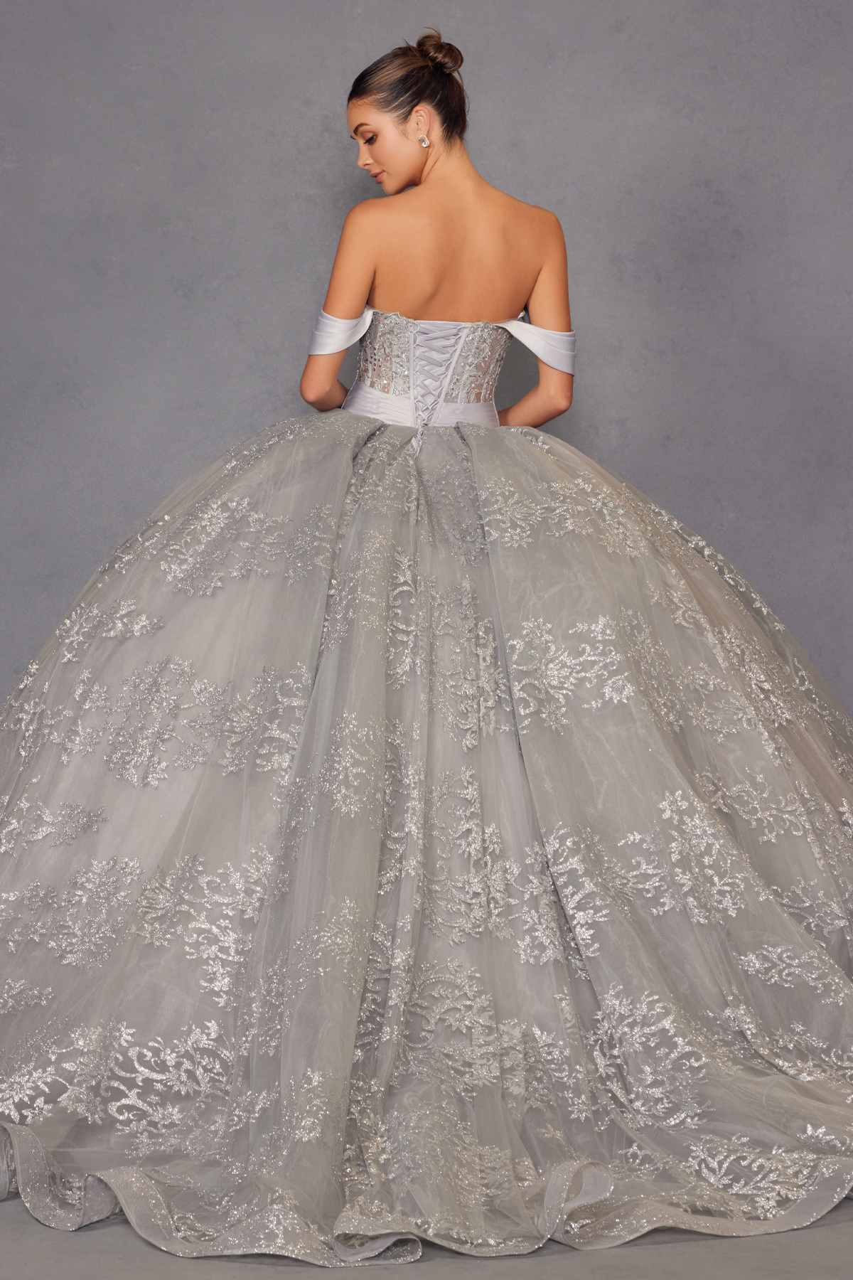 Silver A-line ball gown with off-shoulder sleeves, corset waist, and embroidered skirt