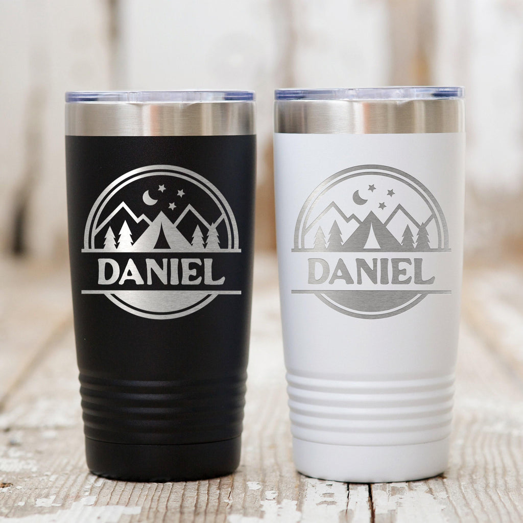 Insulated travel mugs in black and white, with mountain stars graphic and “Daniel” logo