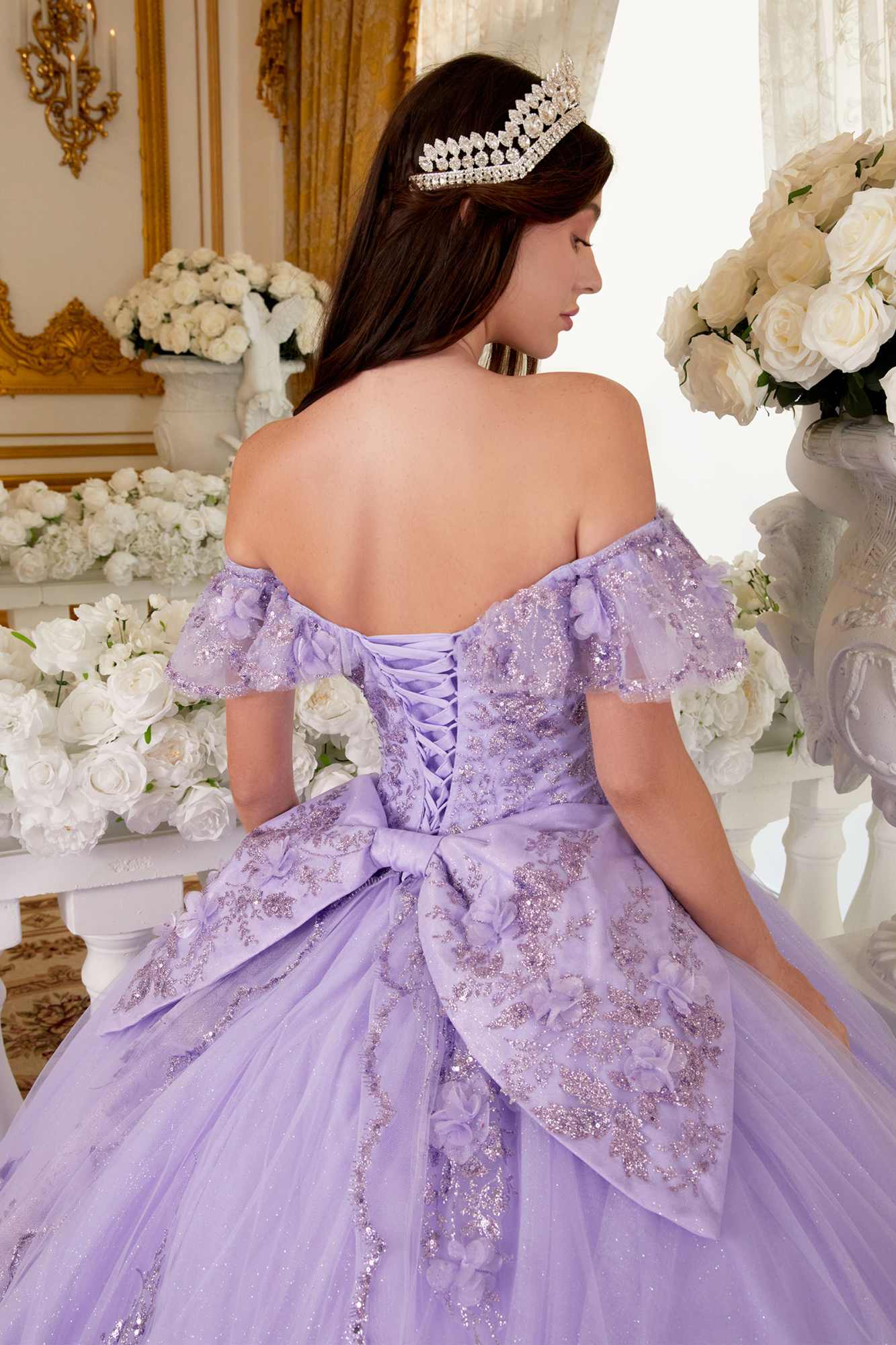 Lavender off-shoulder A-line quince ball gown with floral embroidery and bow detail
