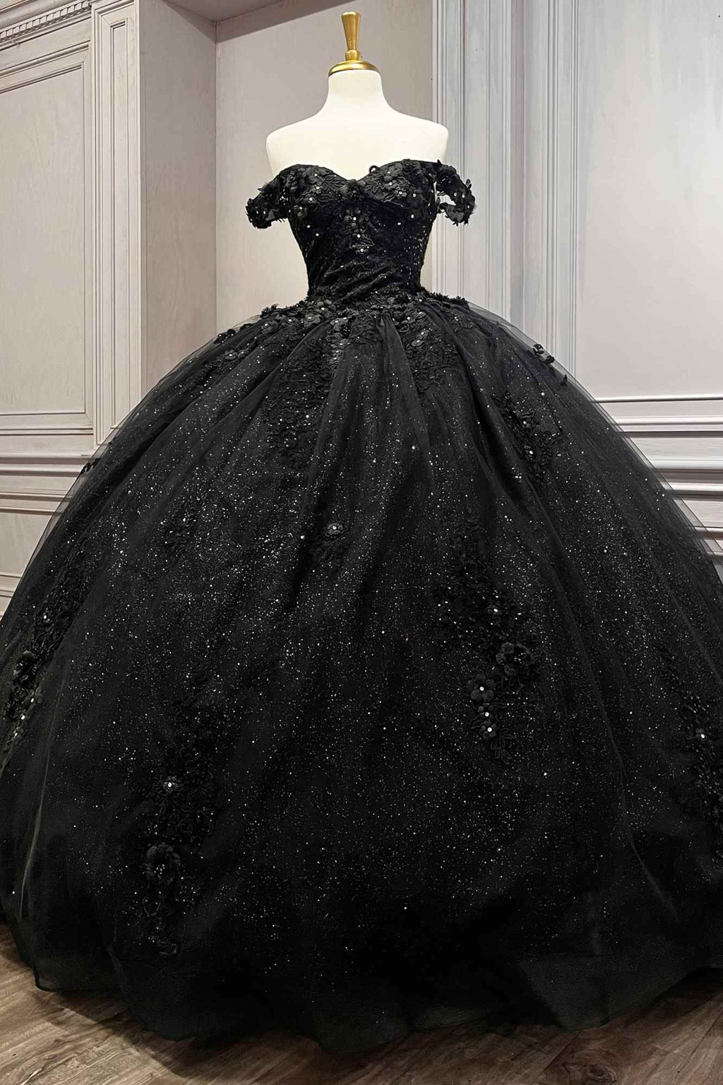 Black off-shoulder ball gown with textured sparkle tulle and short off-shoulder sleeves