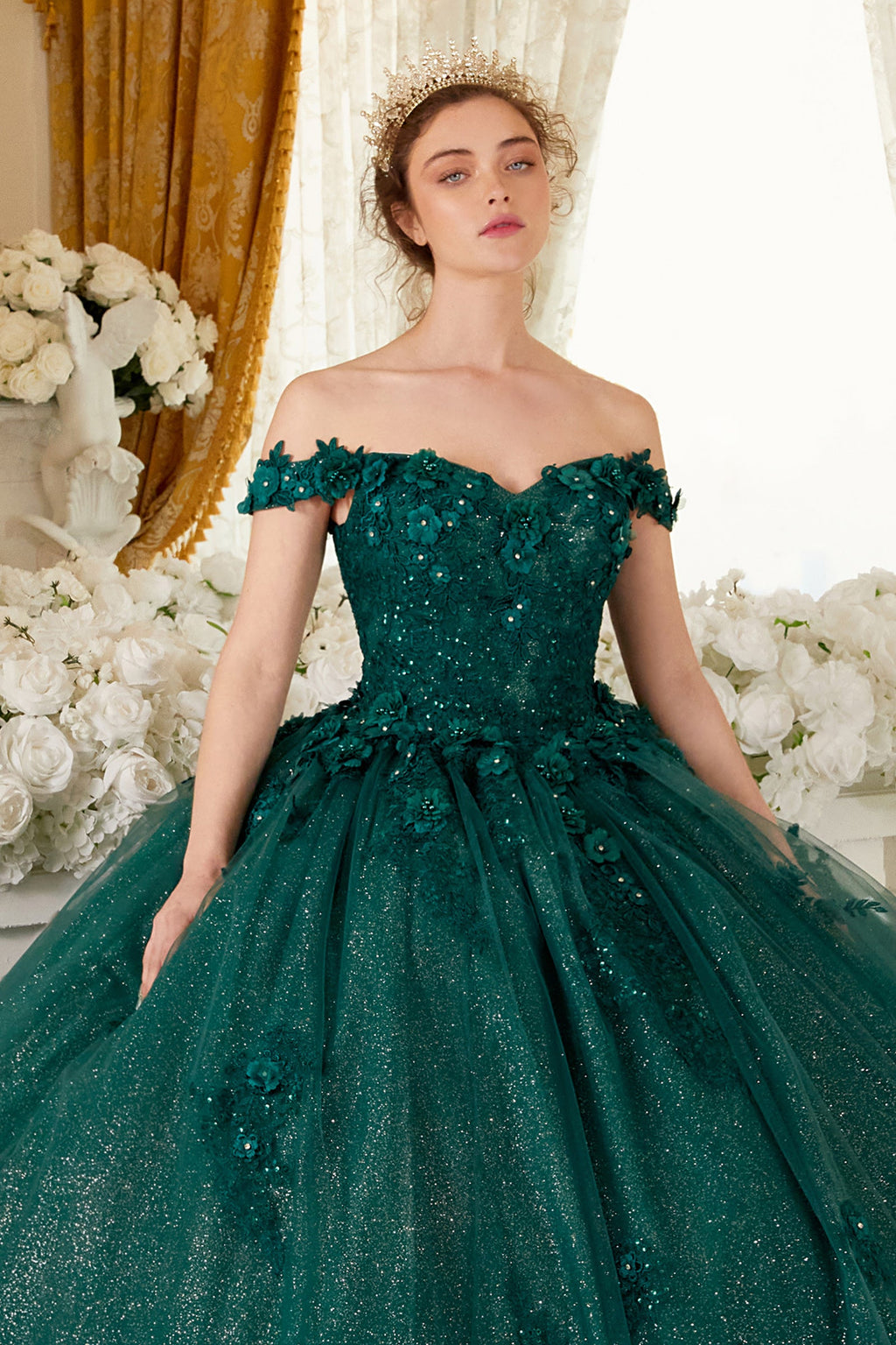 Emerald green off-shoulder ball gown with glittery bodice and full tulle skirt