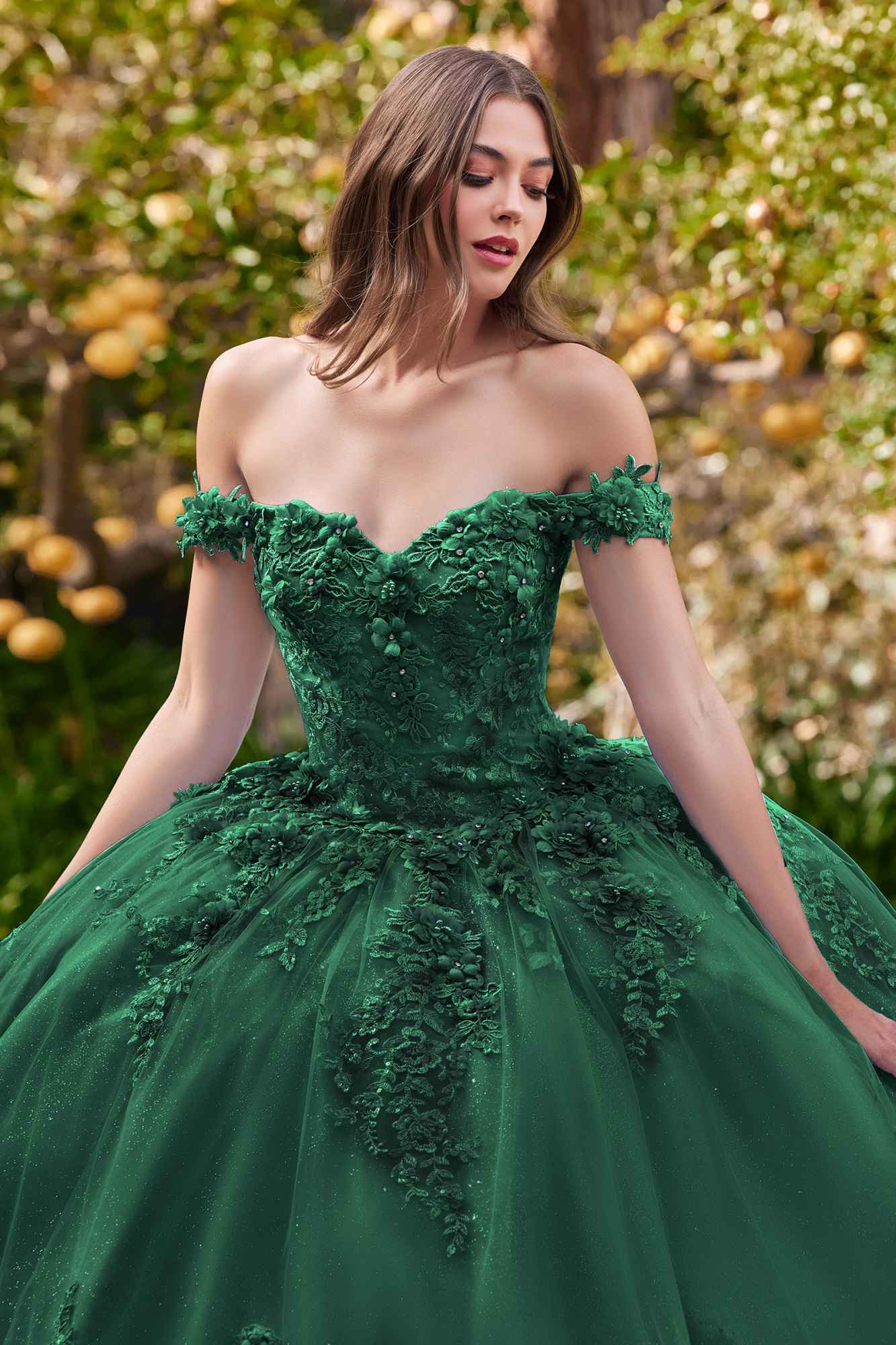 Emerald green off-shoulder ball gown with textured bodice and full tulle skirt