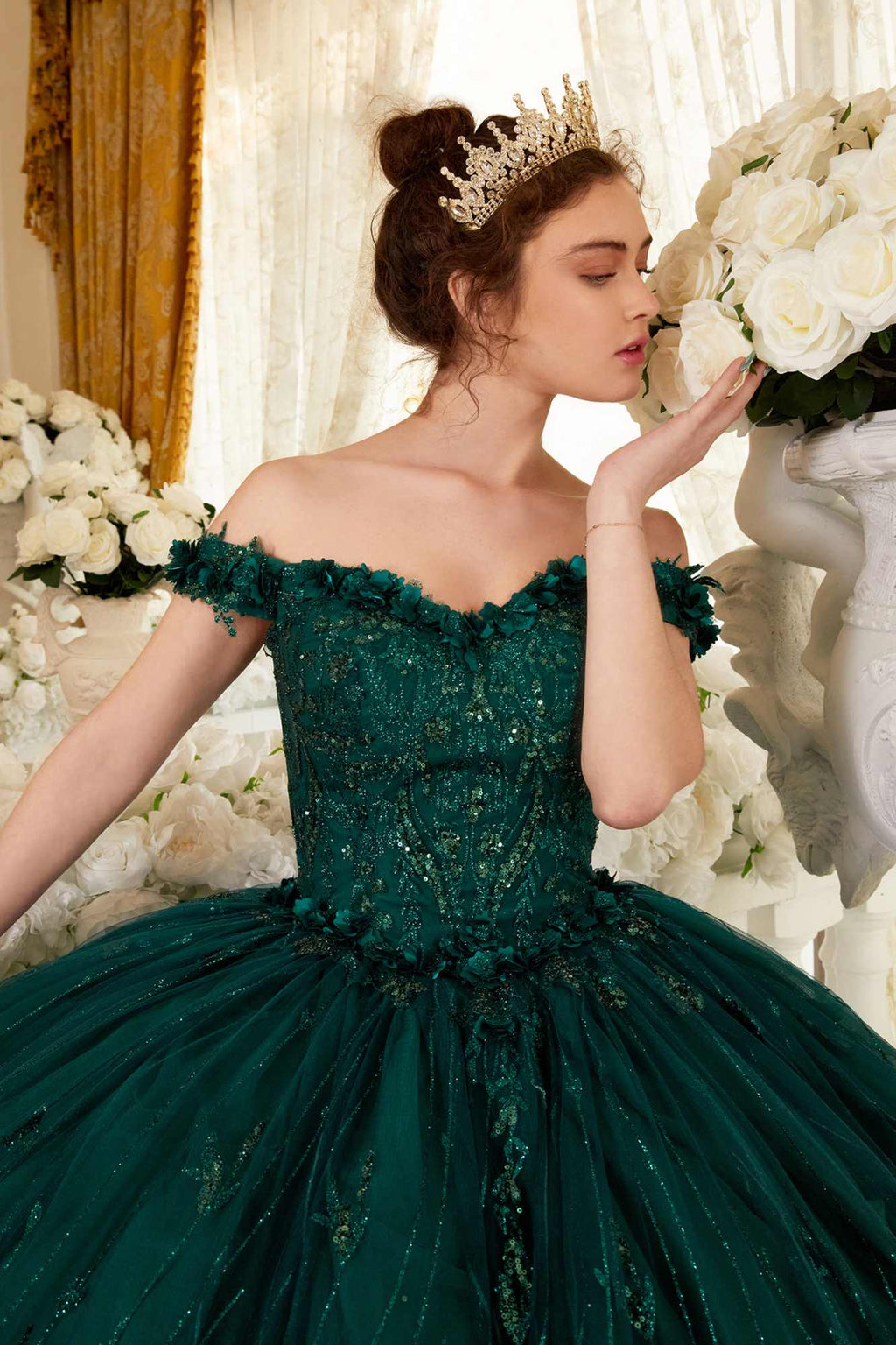 Emerald green off-shoulder ball gown with ruffled sleeve trim and full tiered skirt