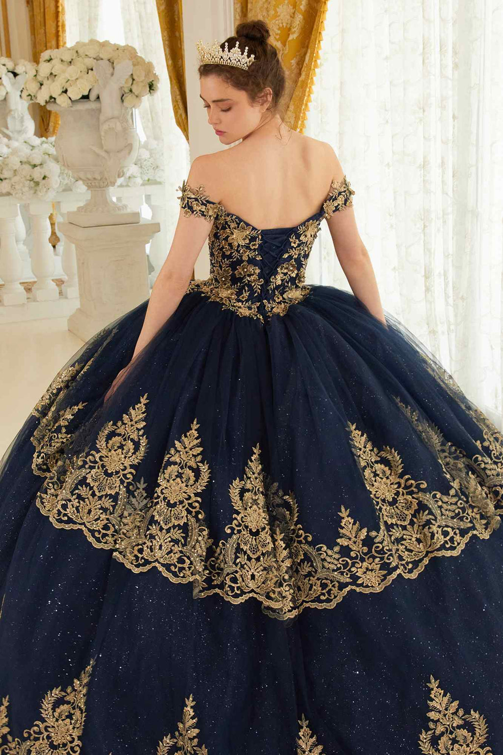 Navy blue off-shoulder ball gown with open back and gold embroidered full skirt