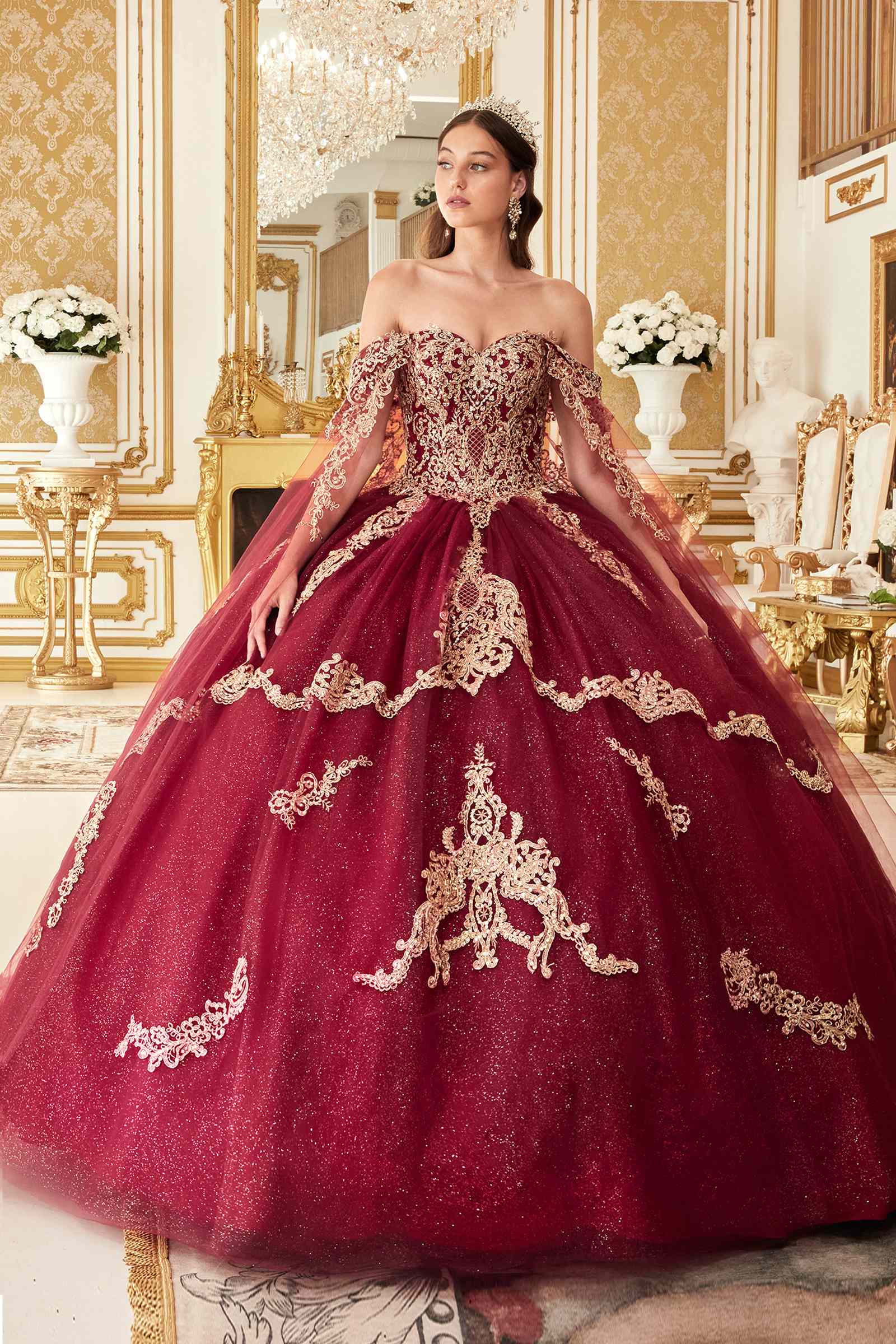 Burgundy off-shoulder ball gown with ornate gold lace appliques and glitter tulle