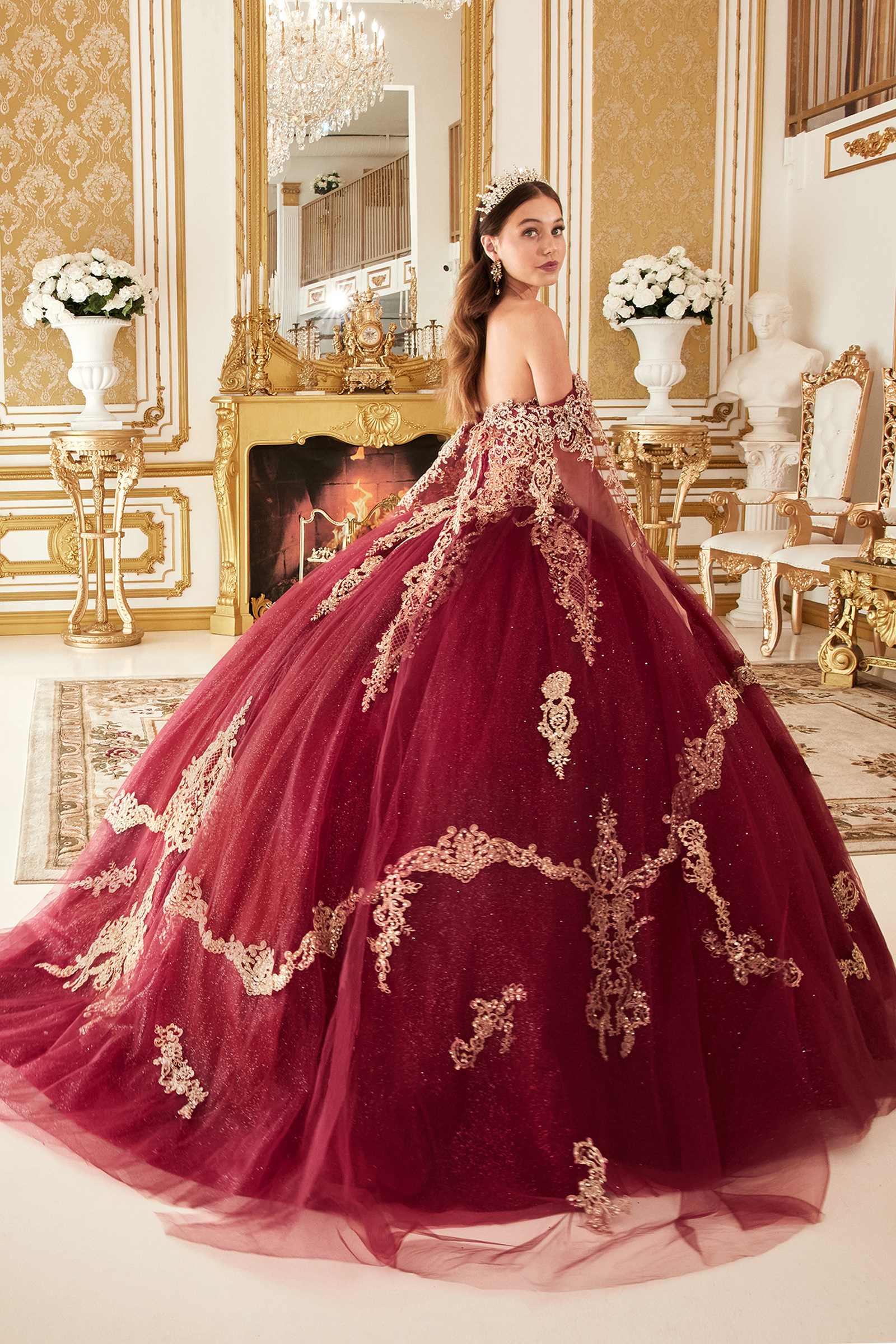 Burgundy off-shoulder A-line ball gown with gold lace embroidery across full skirt