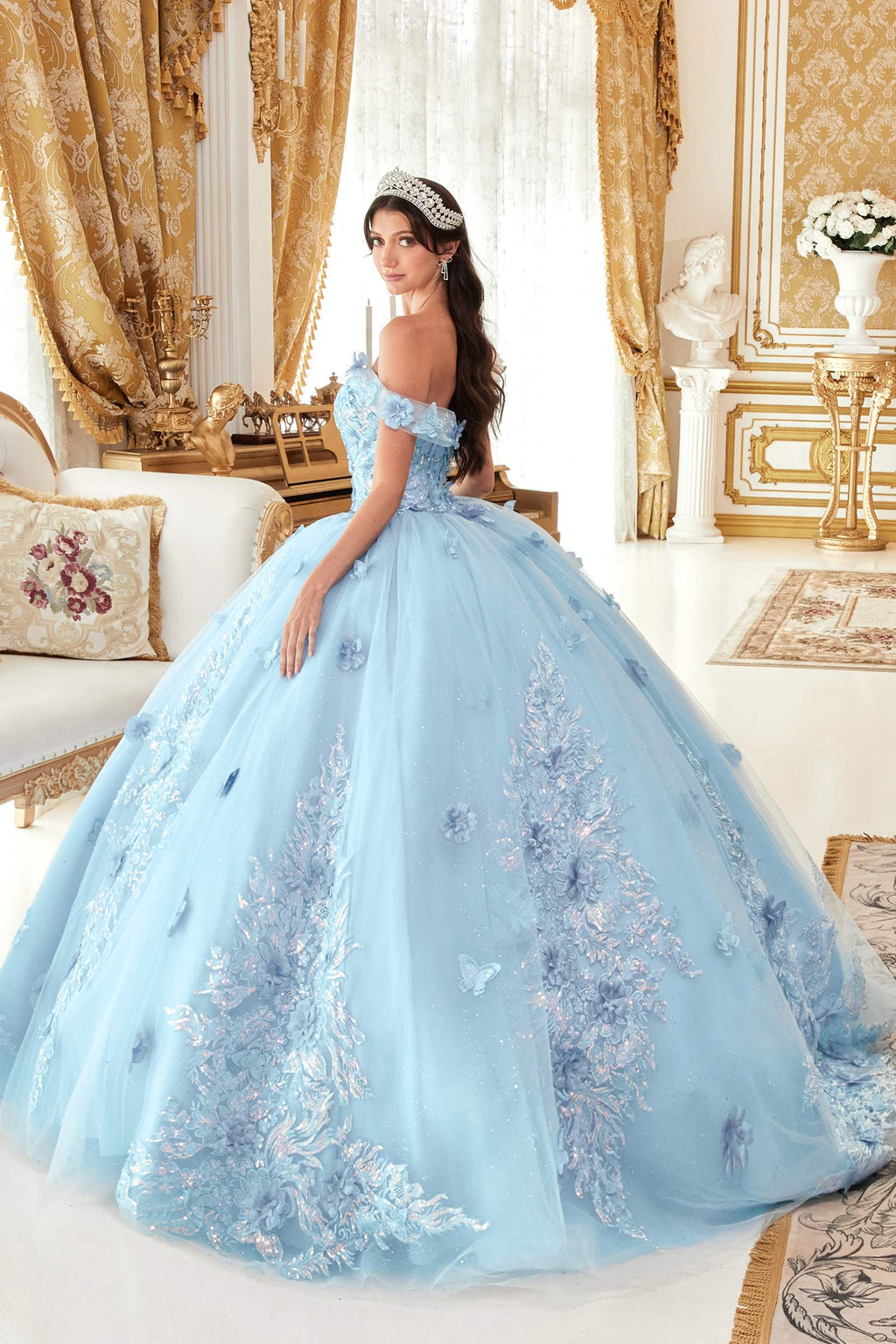 Light blue off-shoulder A-line ball gown with floral embroidery and layered full skirt, side view