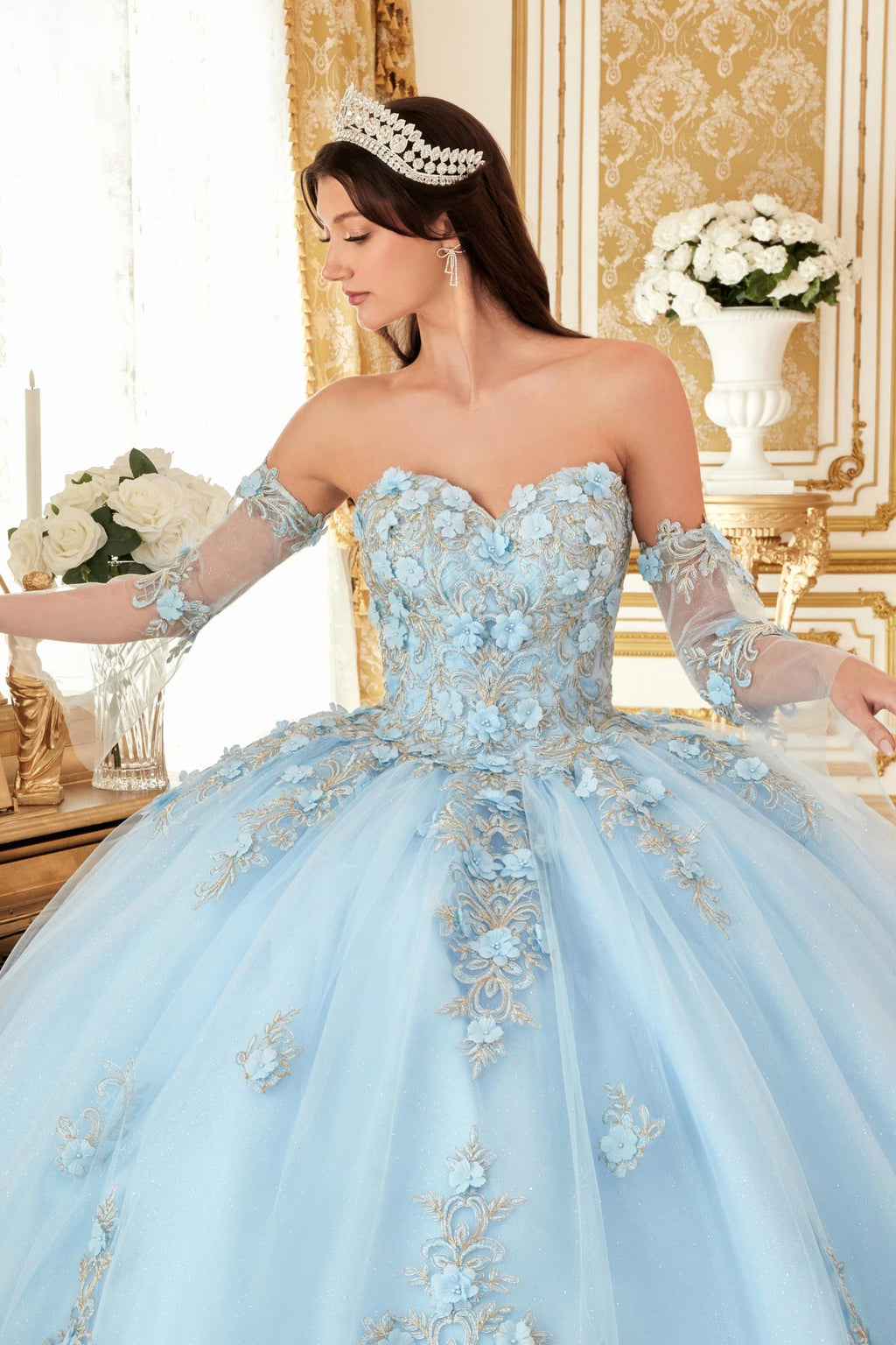 Light blue strapless ballgown with ornate lace bodice, full skirt, and elbow gloves