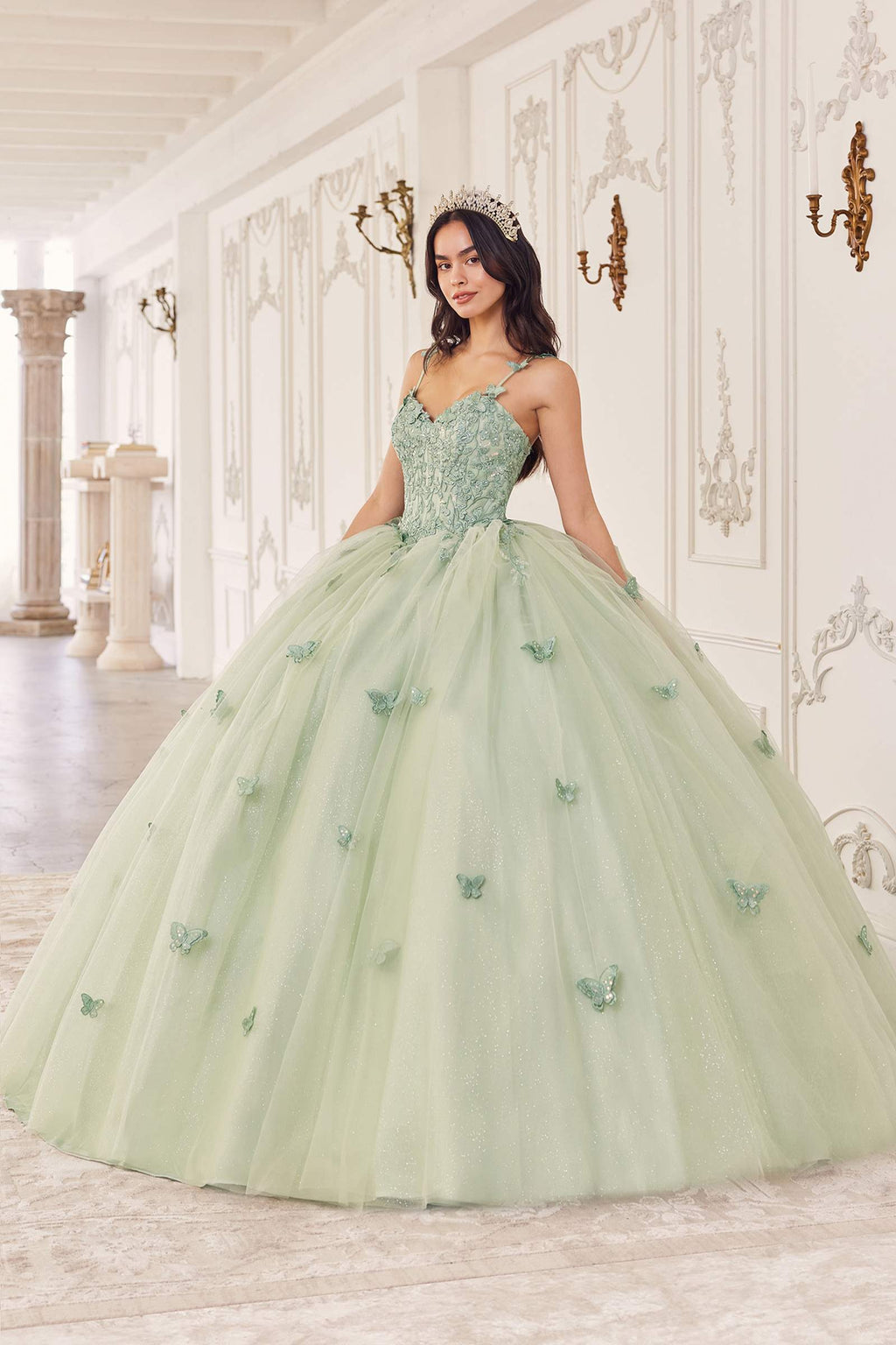 Sage green tulle ball gown with sweetheart neckline and layered skirt with floral appliques