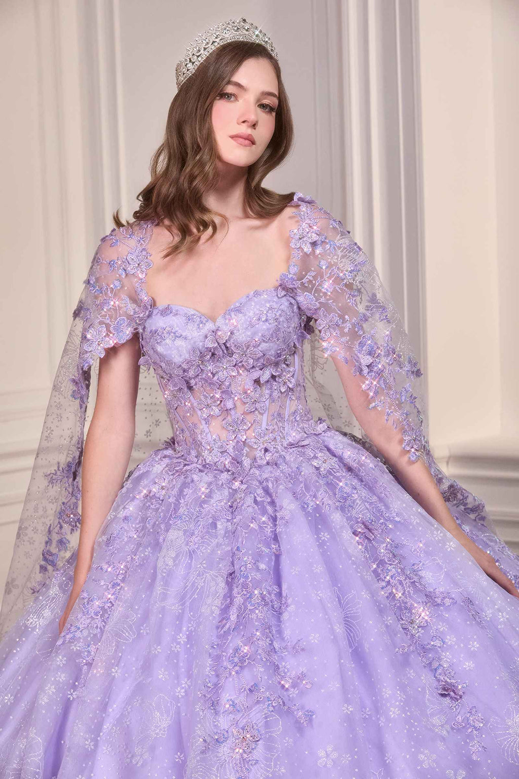 Lavender quinceañera gown with sweetheart neckline, embroidered bodice, and sheer tulle cape