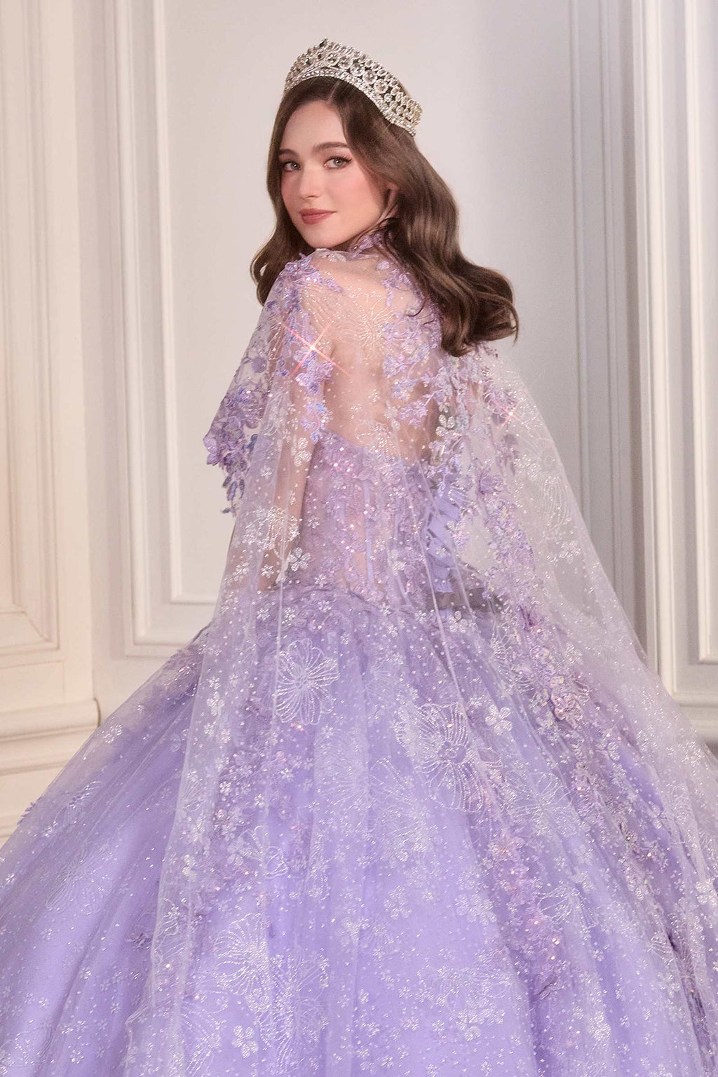 Lavender poofy quinceañera gown with sheer tulle cape overlay and sparkling fitted bodice
