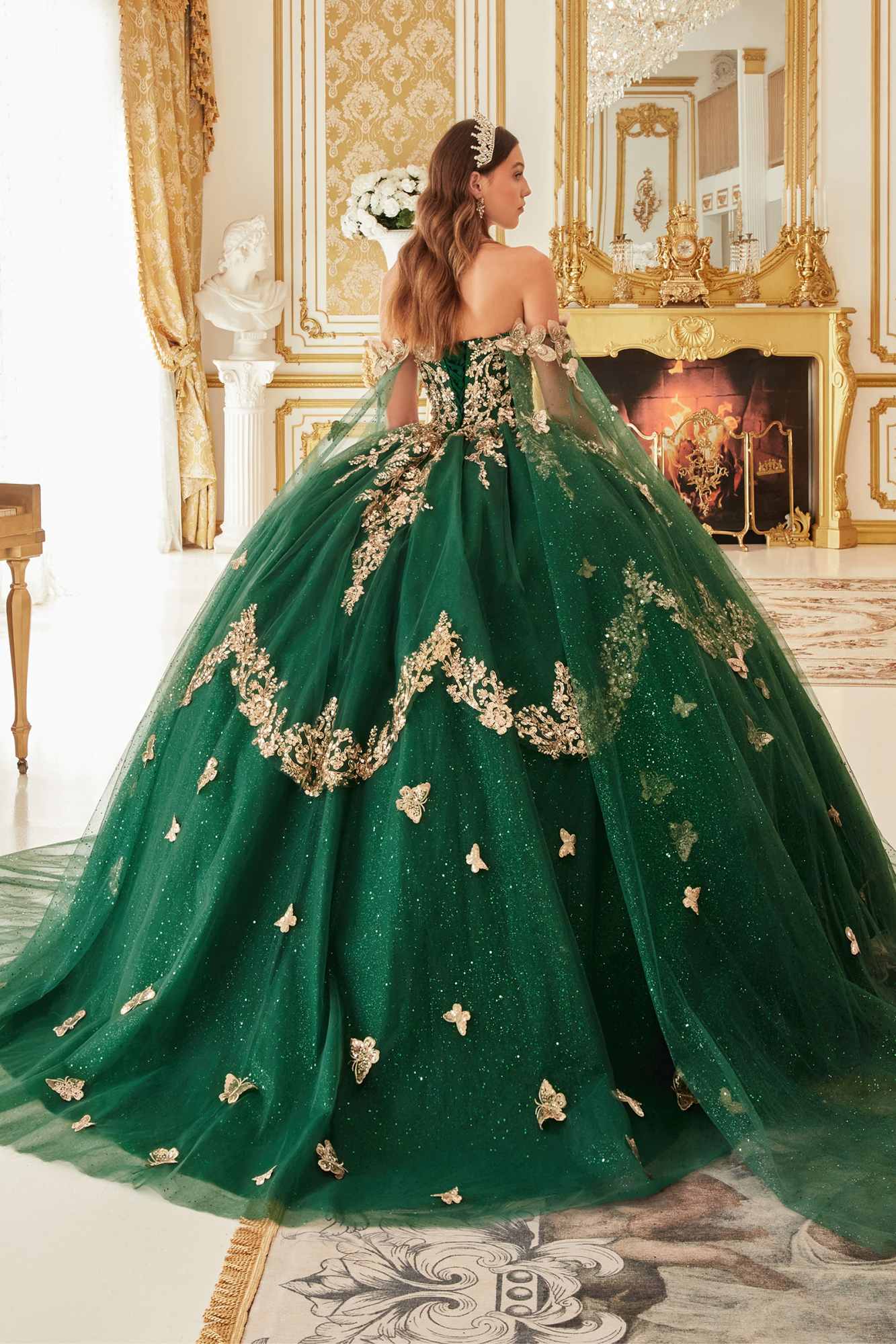 Emerald green strapless ball gown with lace applique and flowing tulle cape back