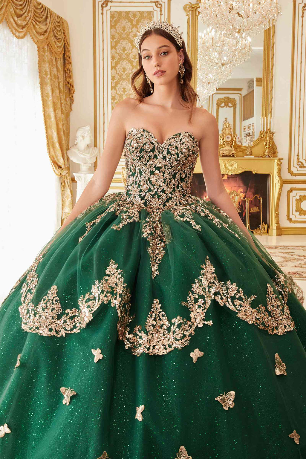 Emerald green strapless ball gown with ornate lace bodice and lace cape overlay