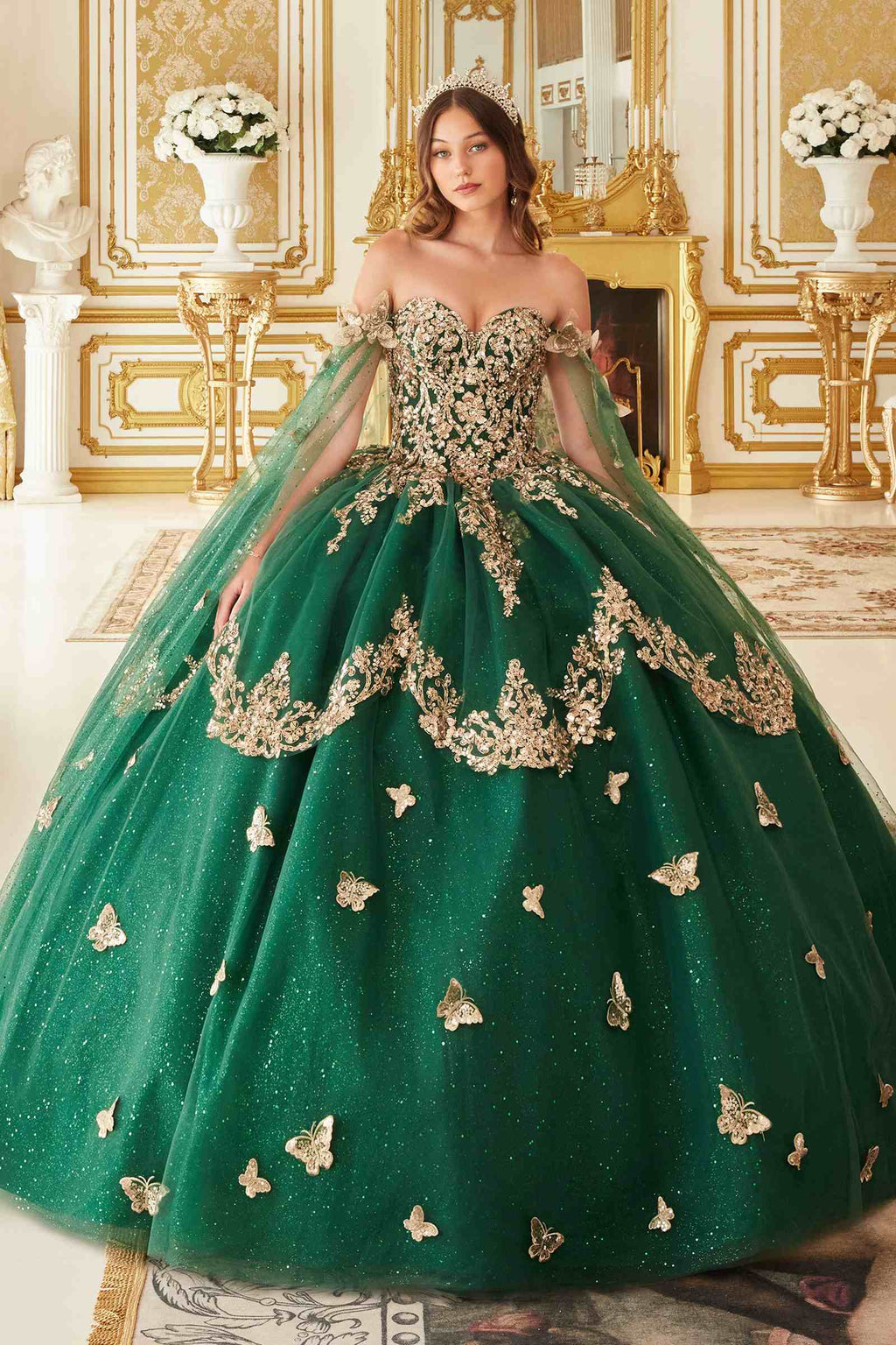 Emerald green strapless ball gown with lace bodice and tulle cape sleeves