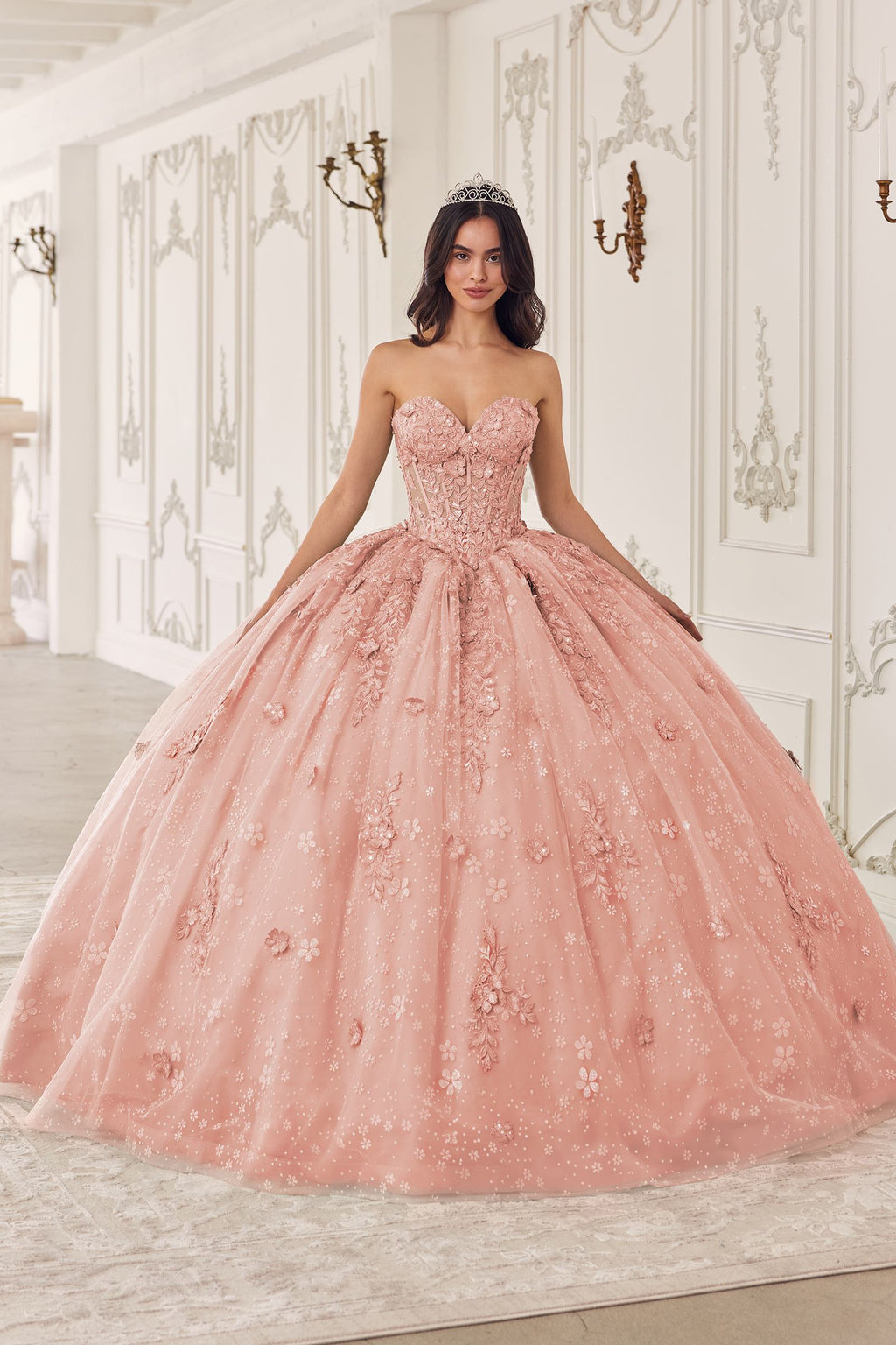 Blush pink A-line quinceanera dress with puff sleeves and sparkling embroidered bodice