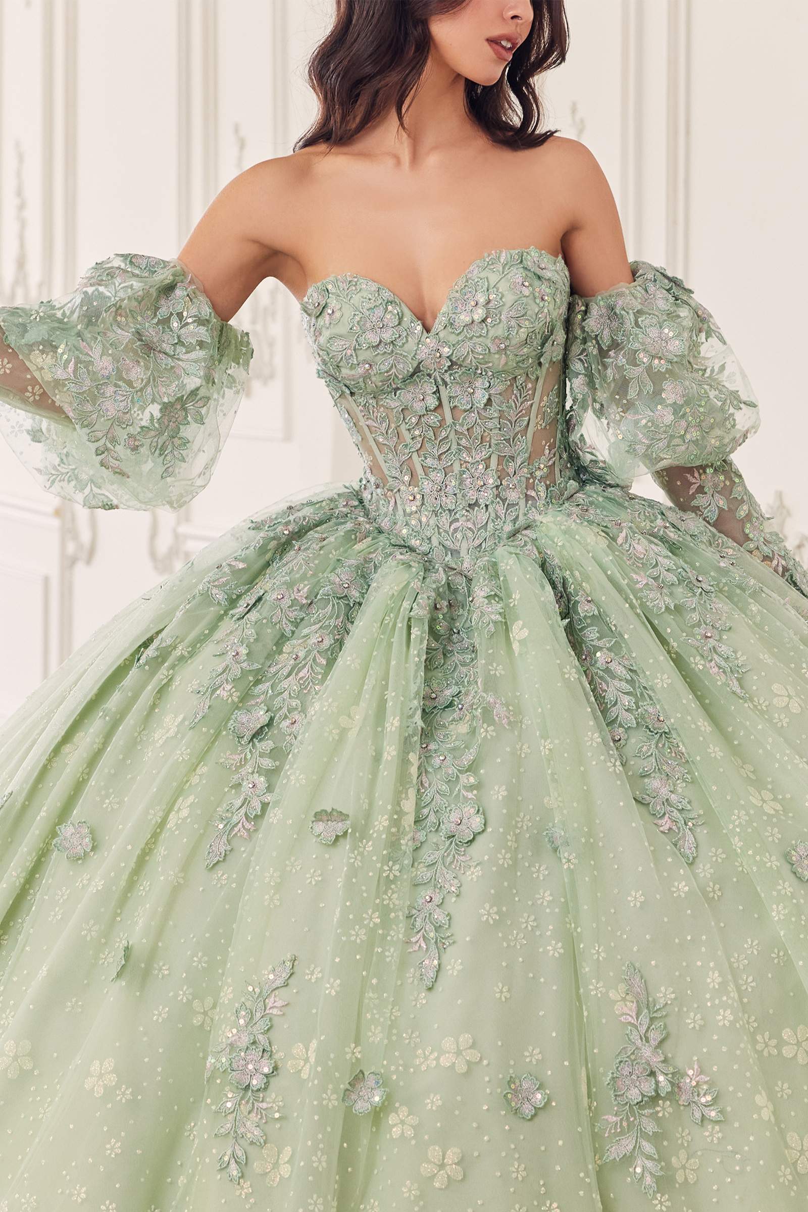 Sage green off-shoulder ball gown with puff sleeves and floral embroidered details