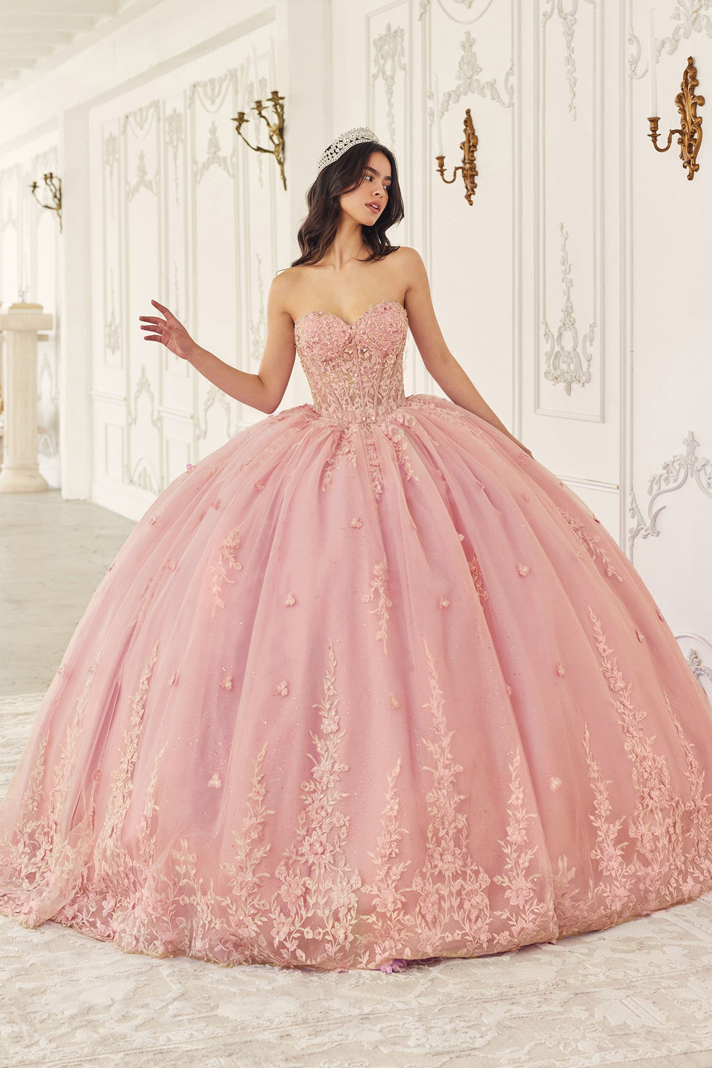 Blush quinceanera gown with beaded bodice and poofy A-line tulle skirt