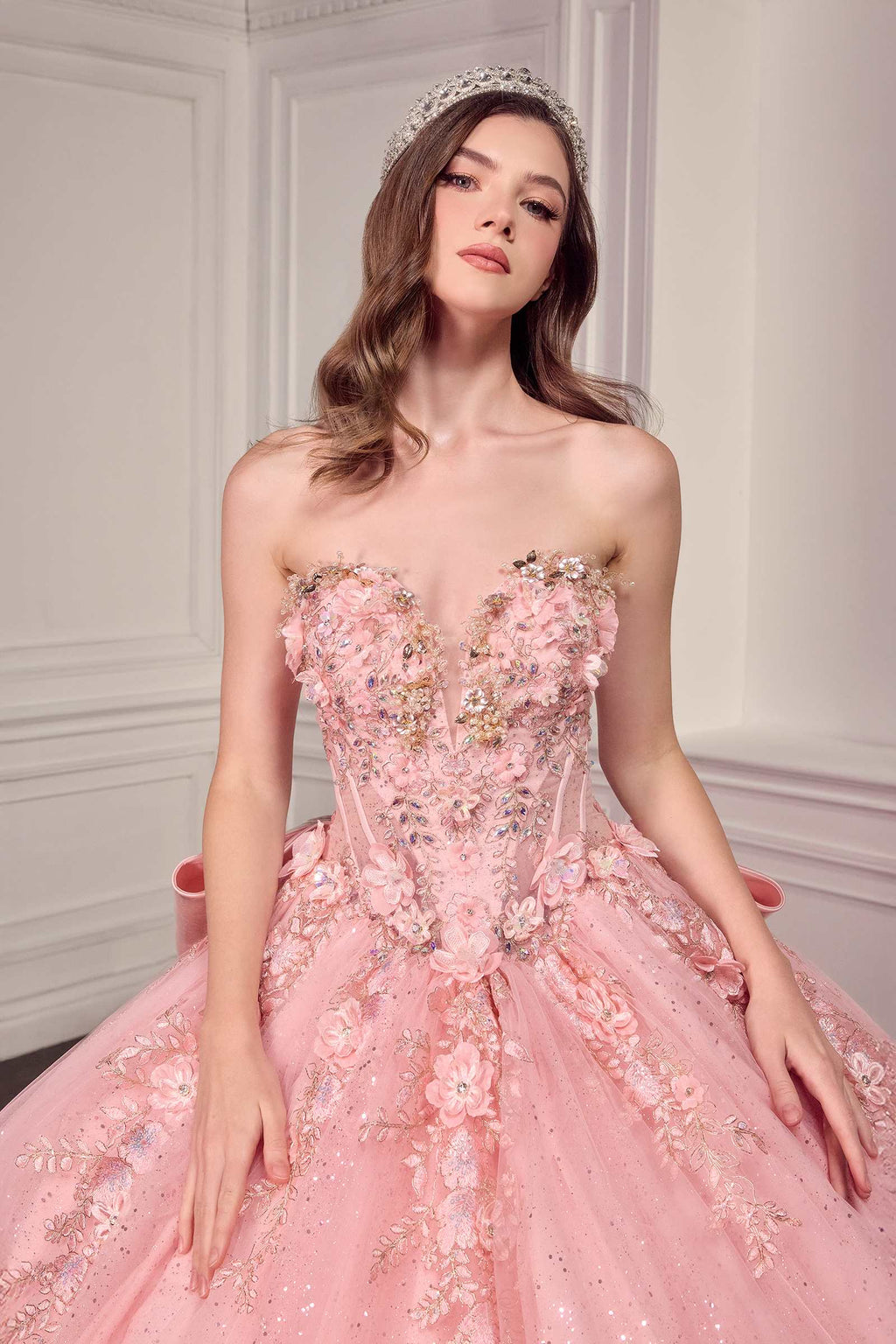 Light pink strapless sweetheart ball gown with intricate beaded bodice and tulle skirt