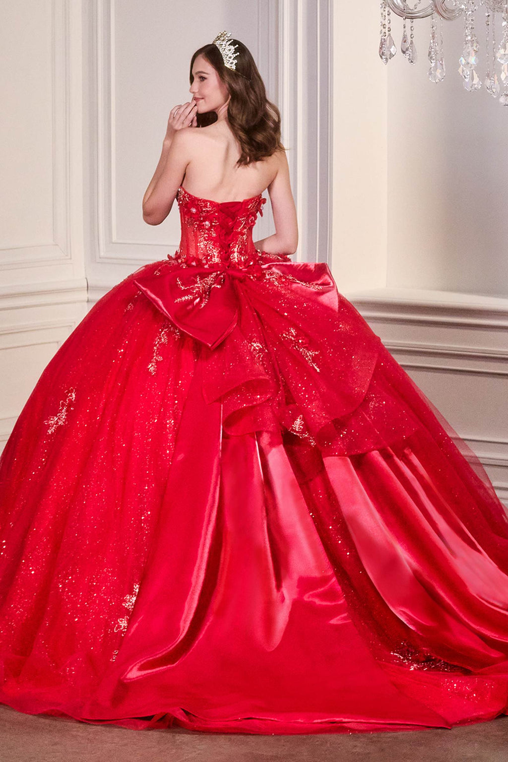 Red strapless sweetheart ball gown with beaded corset bodice and full tulle skirt
