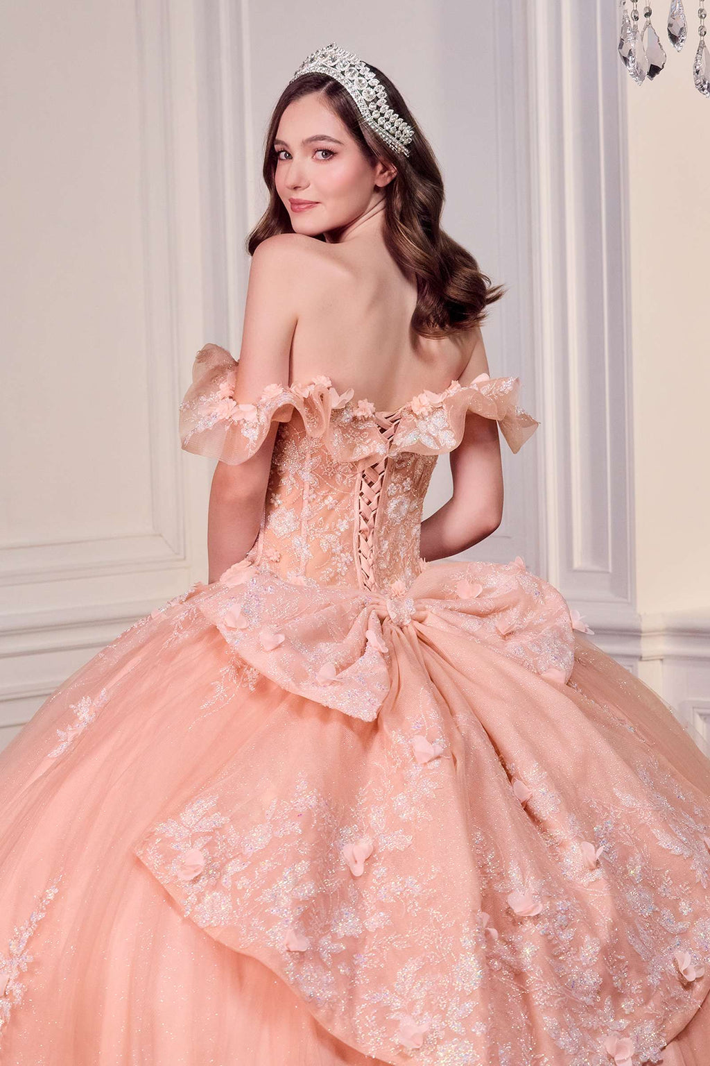 Blush off-shoulder ball gown with lace corset, ruffled sleeves, and layered A-line skirt