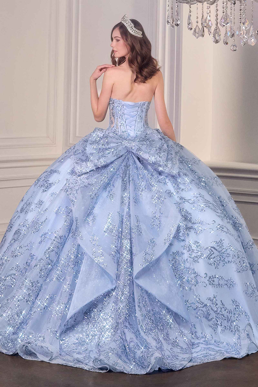 Blue strapless sweetheart ball gown with corset back, full puffed skirt, glitter details.