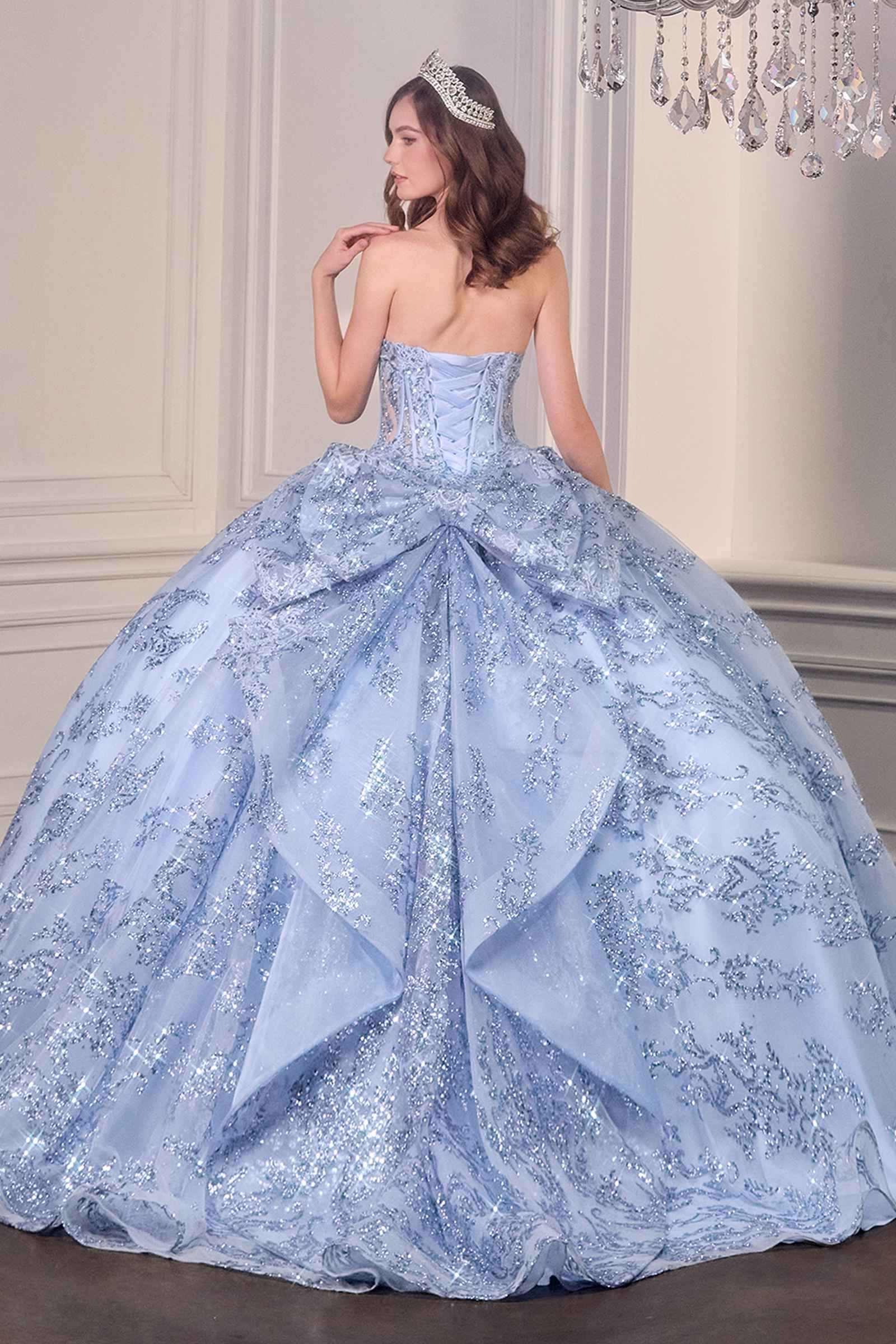Blue strapless sweetheart ball gown with corset back, full puffed skirt, glitter details.