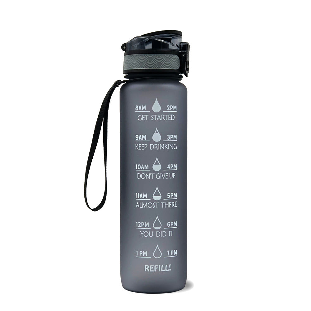 1L gray bottle with black lid and black wrist strap; motivational time markers on front